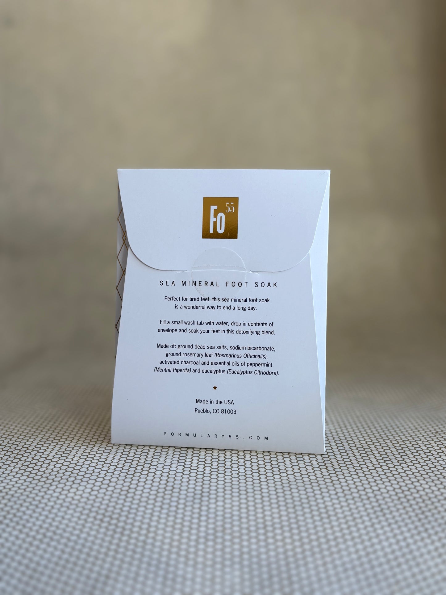 back of Formulary 55 eucalyptus and peppermint Sea Mineral foot soak in white packaging with black floral graphic.