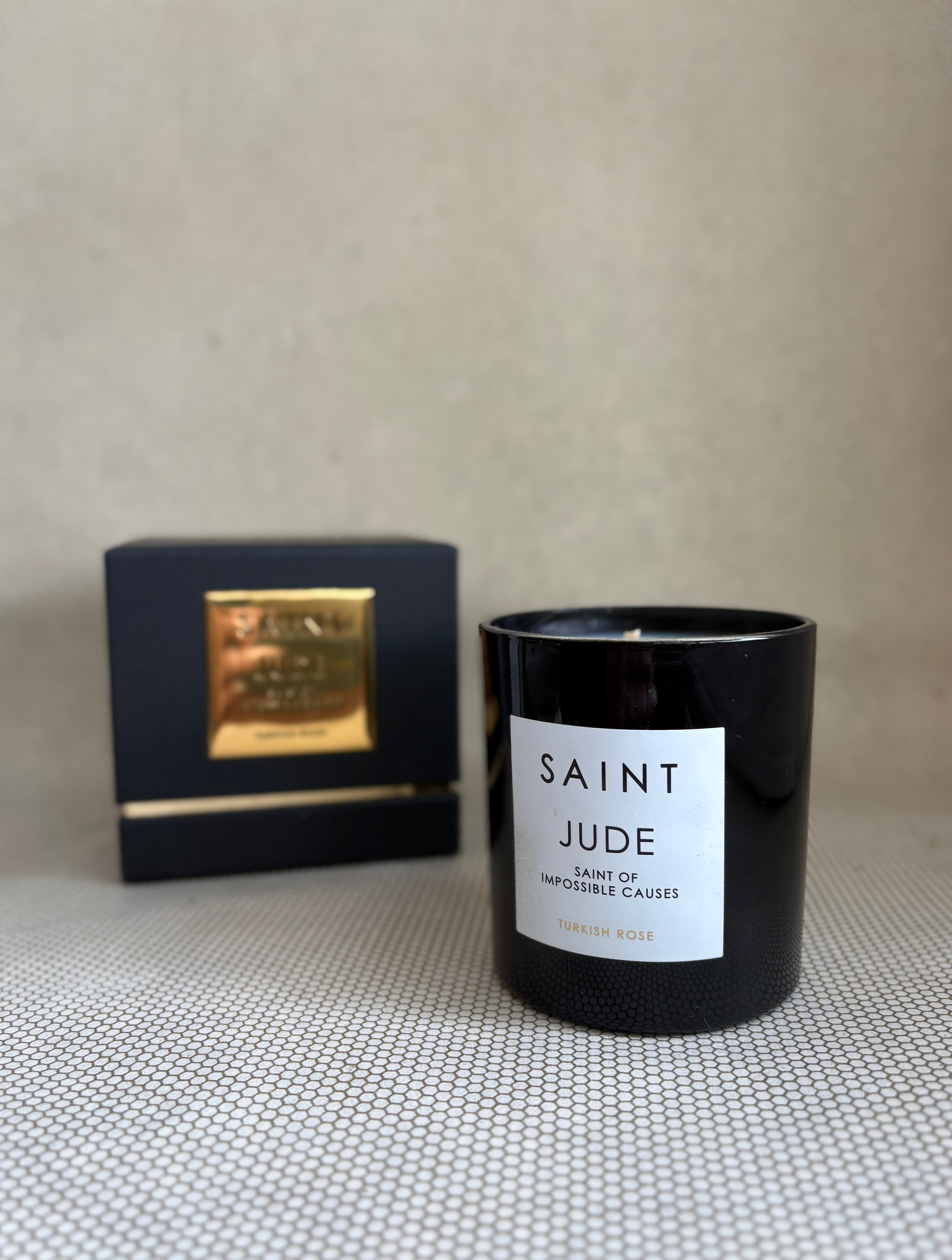 SAINT black glass candle with gold lid. black and gold box for candle. saint jude turkish rose. 11 oz. (8 oz. pour), Measures 3.5" H x 3" D. 