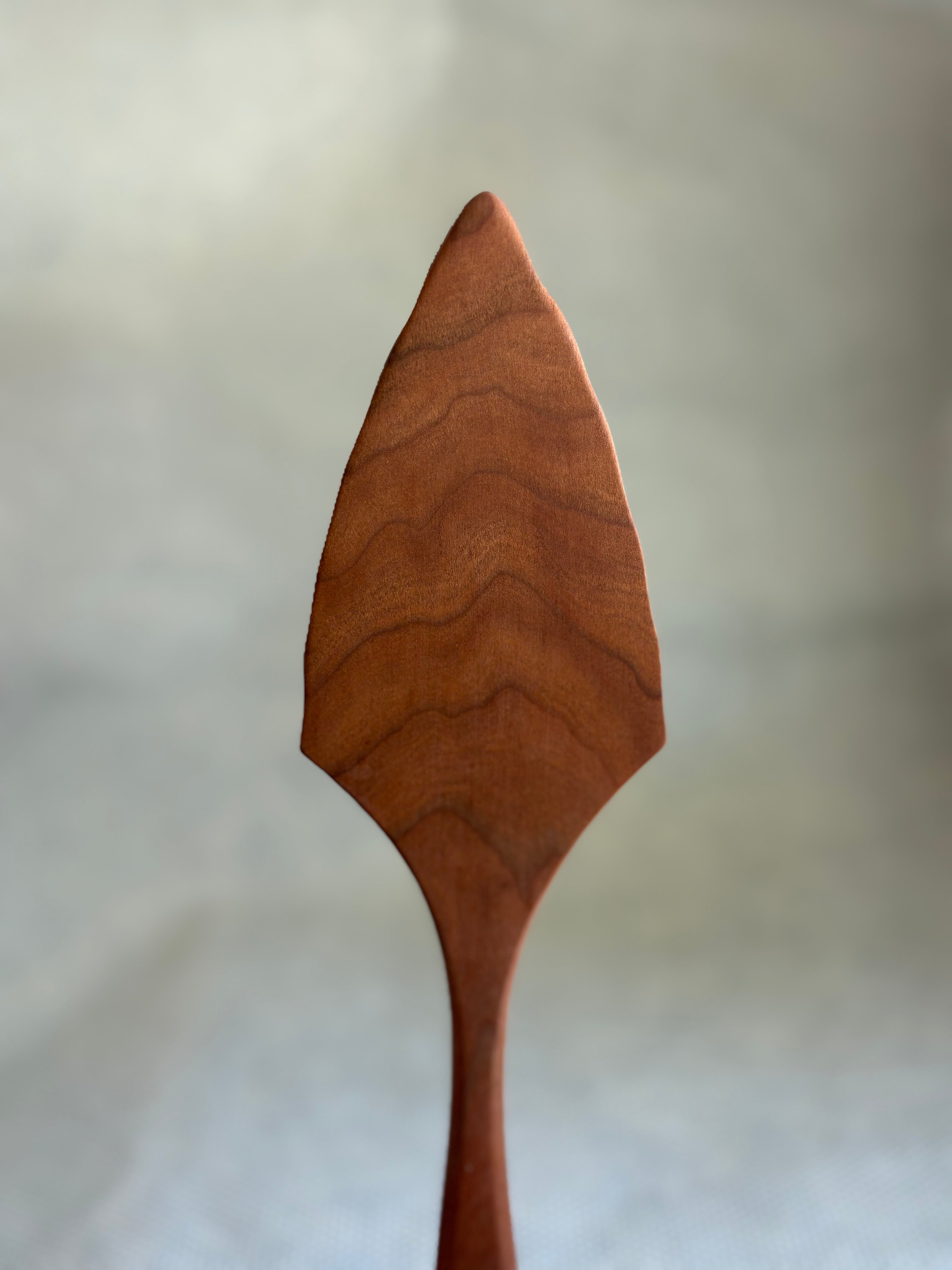 Jonathan's Spoons natural wooden pie server on light natural background. 