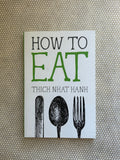 Book cover of 'How to Eat' by Thich Nhat Hanh with utensil illustrations on a textured background