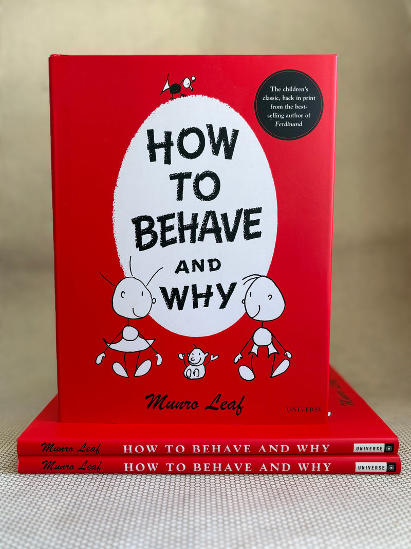 Red book titled 'How to Behave and Why' by Munro Leaf on a beige surface.