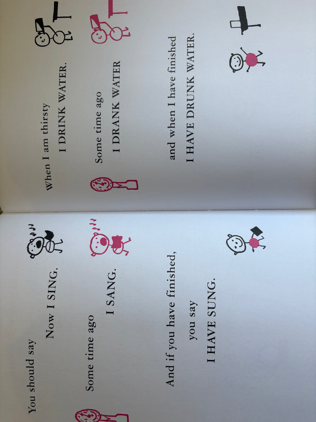 Open book with text and illustrations on a white background