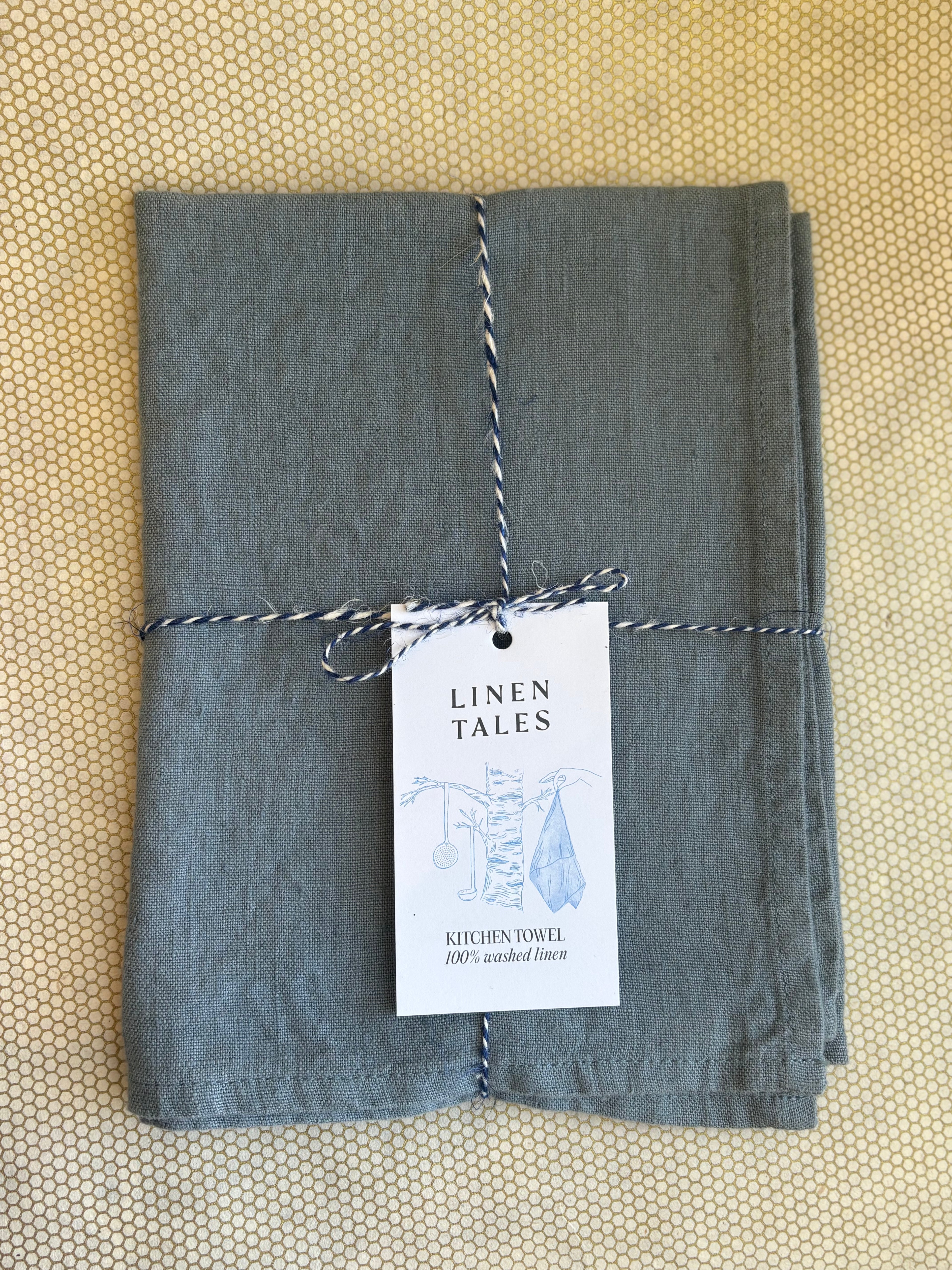 stacked kitchen towel in foggy blue solid color. Linen Tales 100% linen 18''x26''