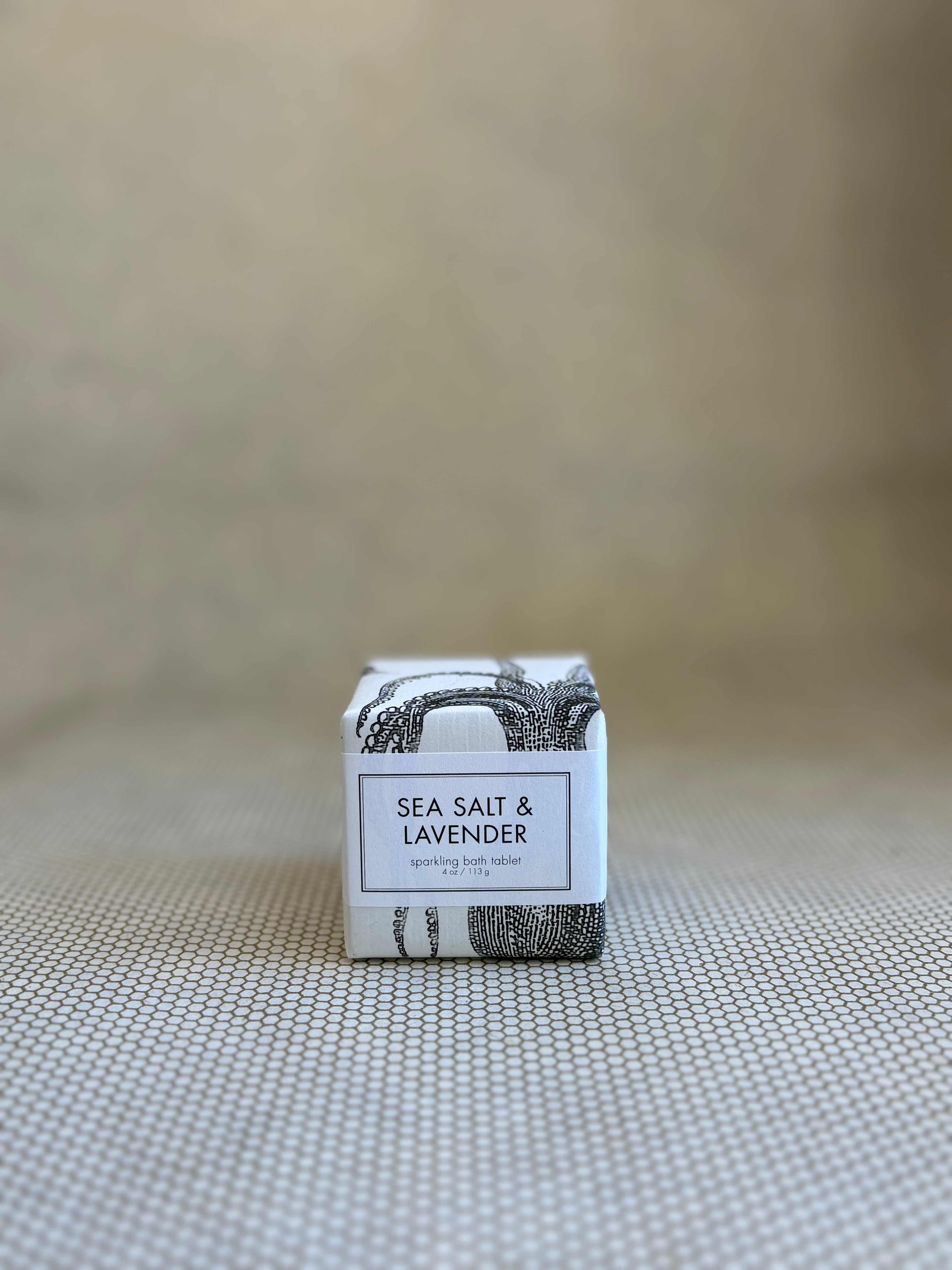 small square package of Formulary 55 sea salt and lavender sparking bath tablets with white and black design on packaging. 