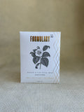 Formulary 55 rosehip and clay facial mask packaging on a textured surface with a neutral background