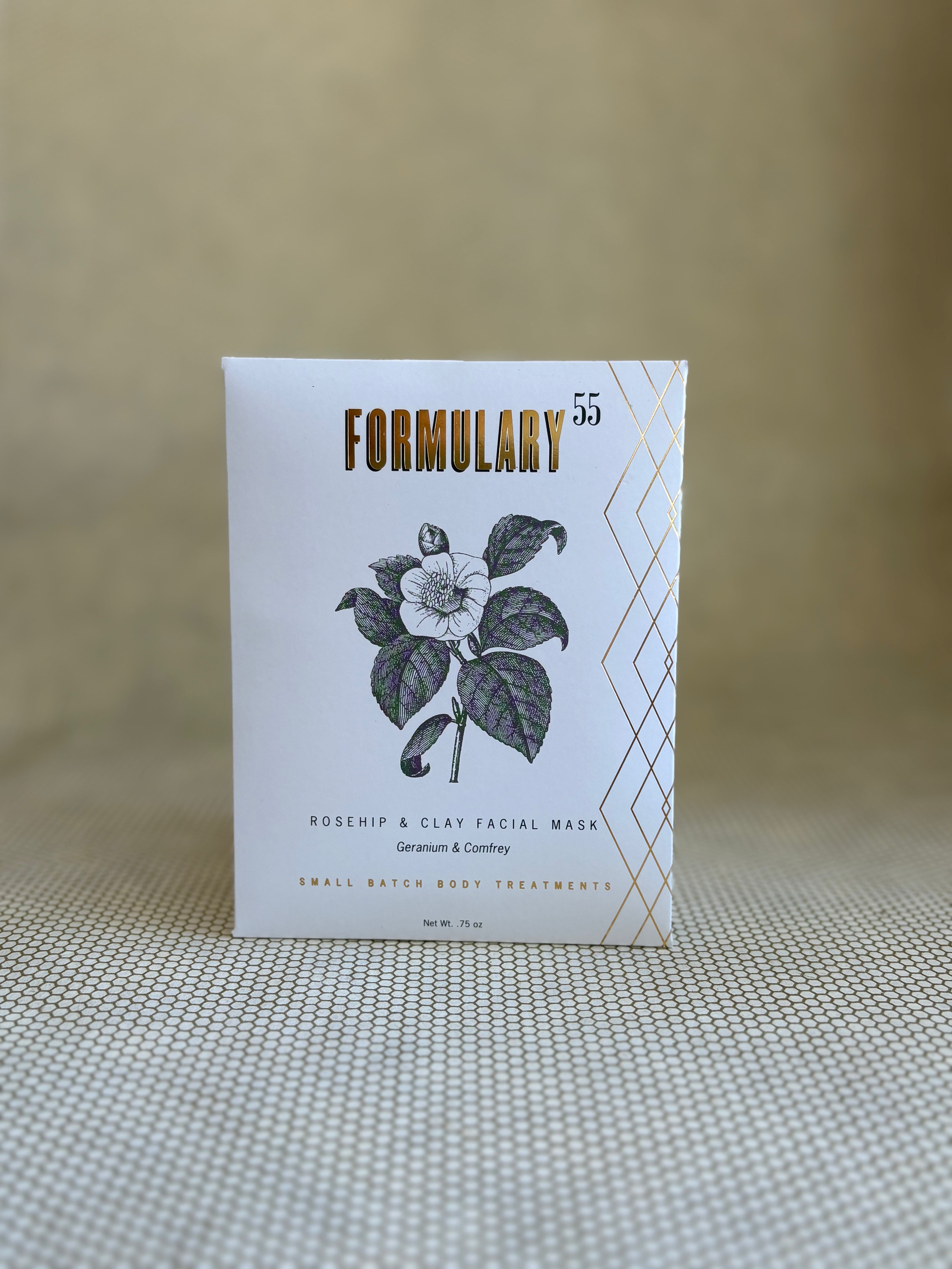 Formulary 55 rosehip and clay facial mask packaging on a textured surface with a neutral background