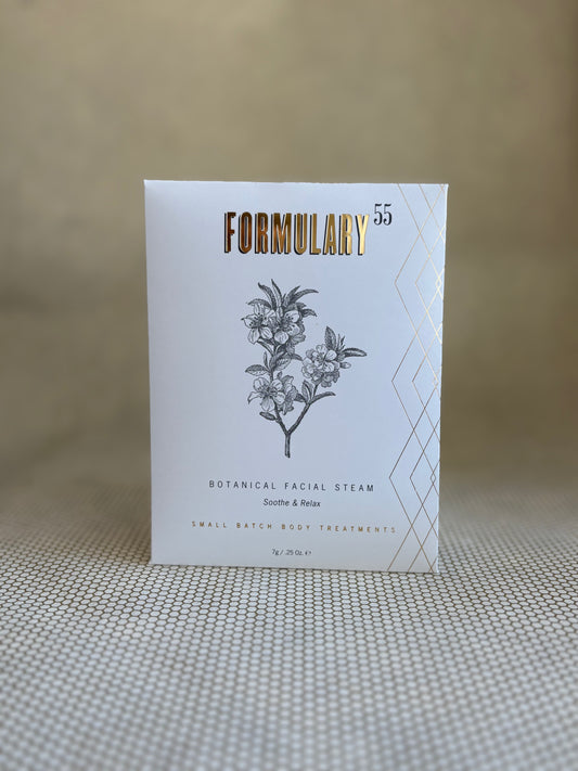 Formulary 55 botanical facial steam packaging on a textured surface with a neutral background
