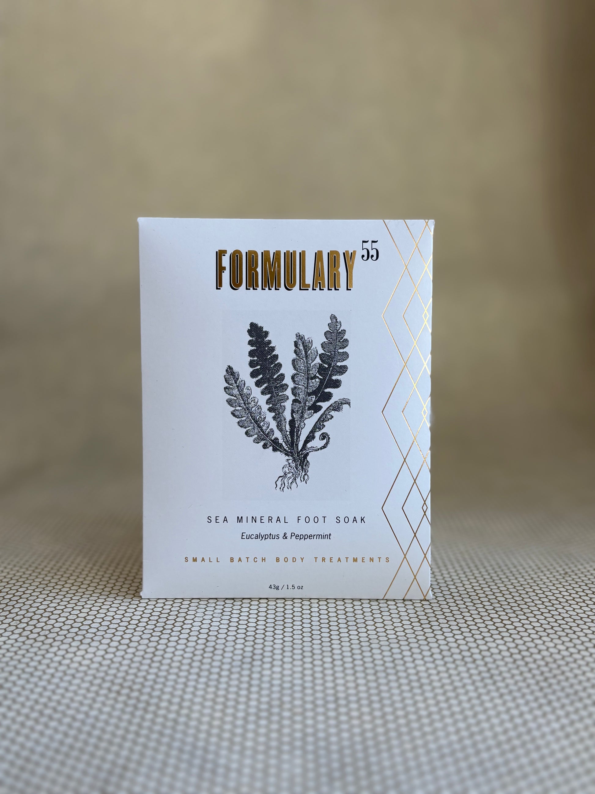 Formulary 55 eucalyptus and peppermint Sea Mineral foot soak in white packaging with black floral graphic. 
