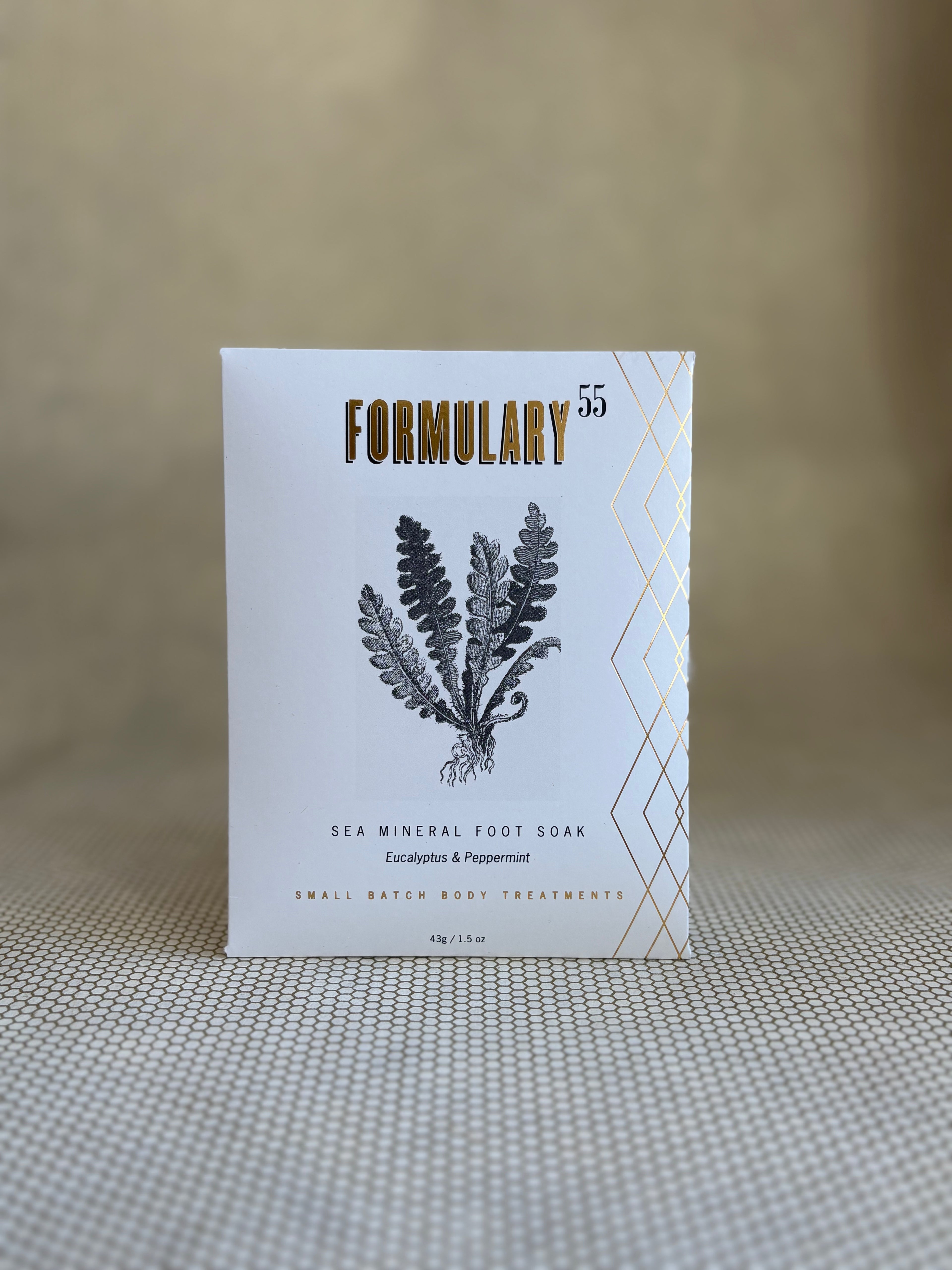 Formulary 55 eucalyptus and peppermint Sea Mineral foot soak in white packaging with black floral graphic. 