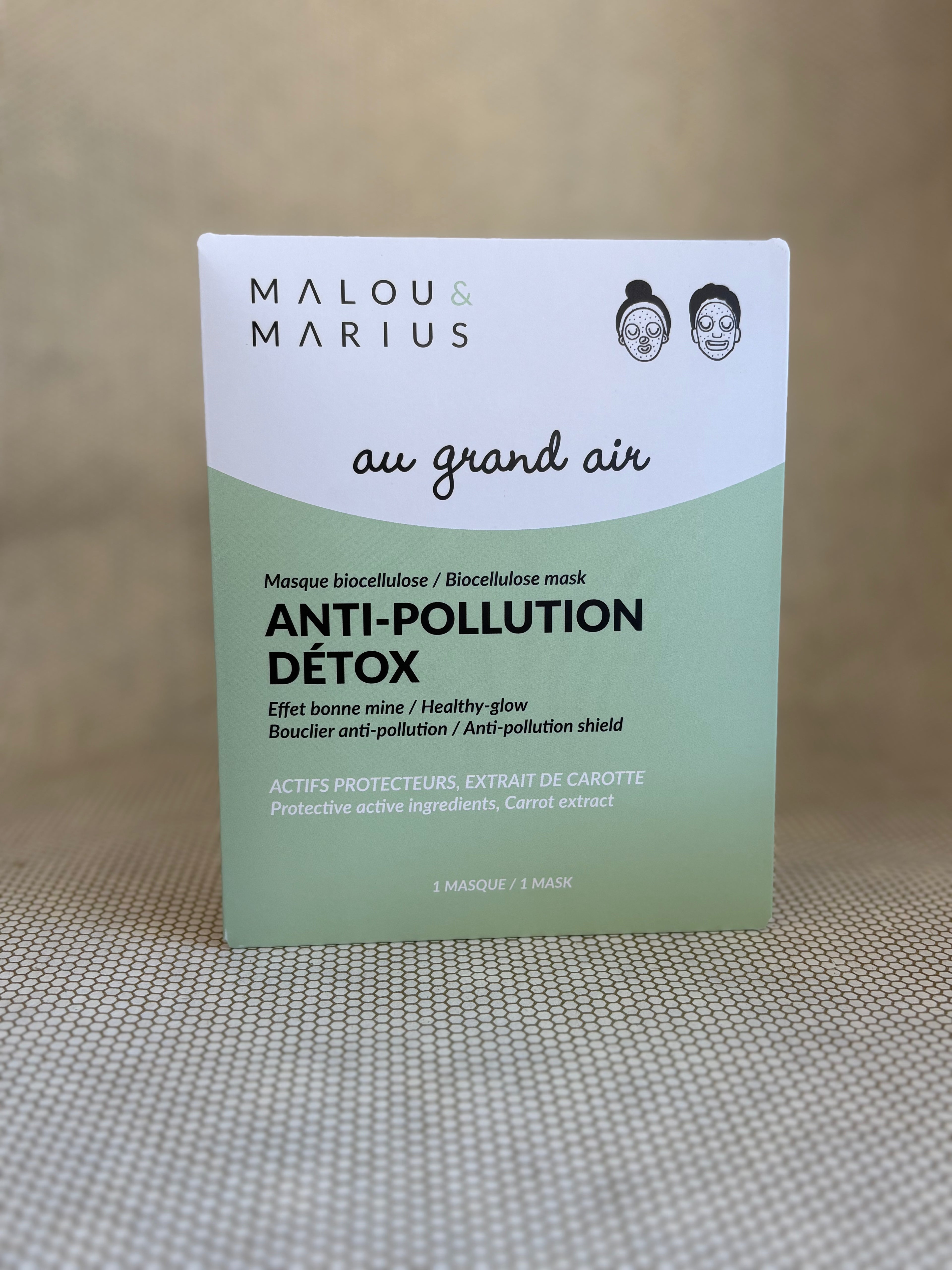 Malou & Marius anti-pollution detox mask white and green packaging on a neutral background