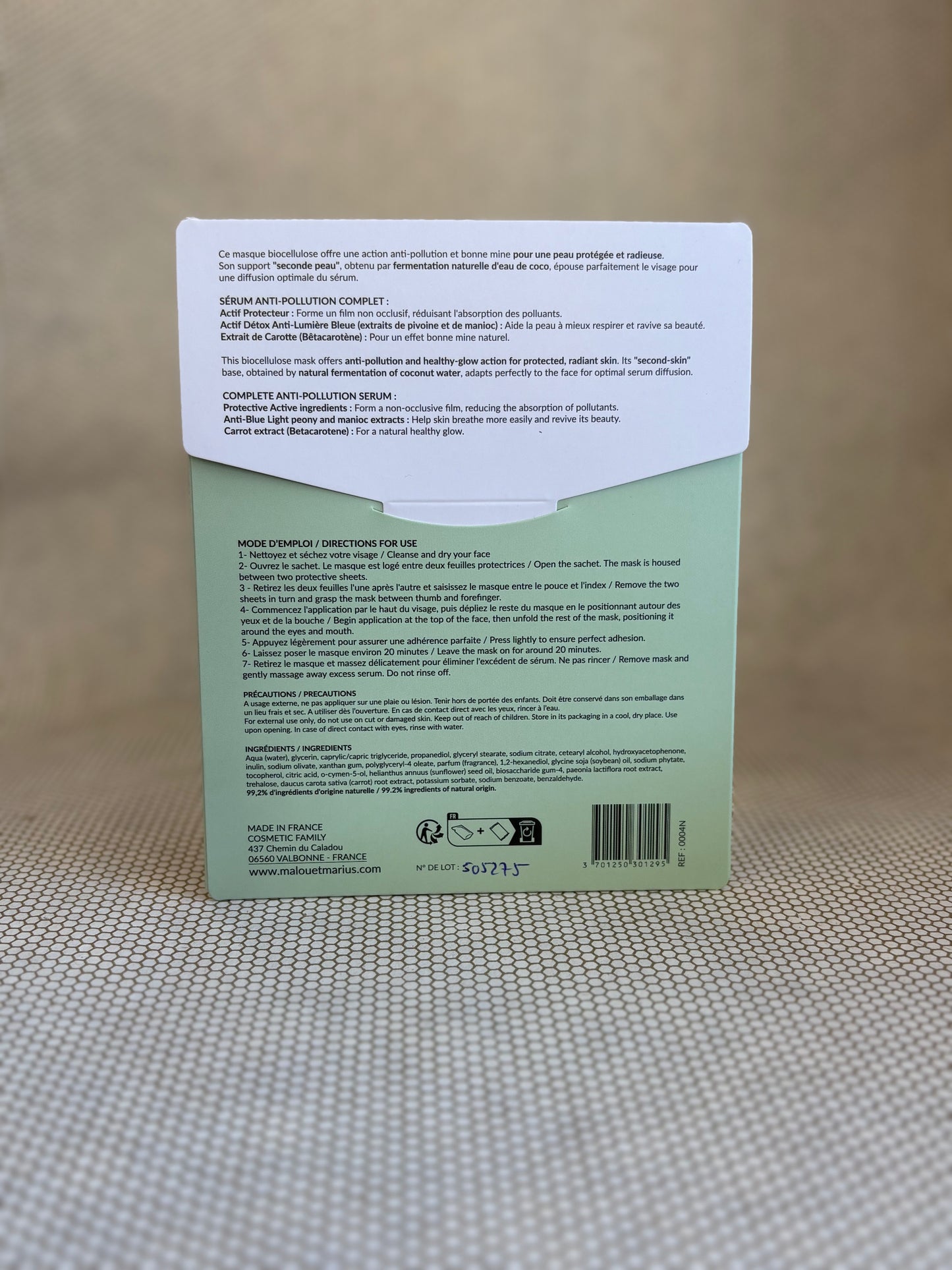 back of Malou & Marius anti-pollution detox mask white and green packaging on a neutral background