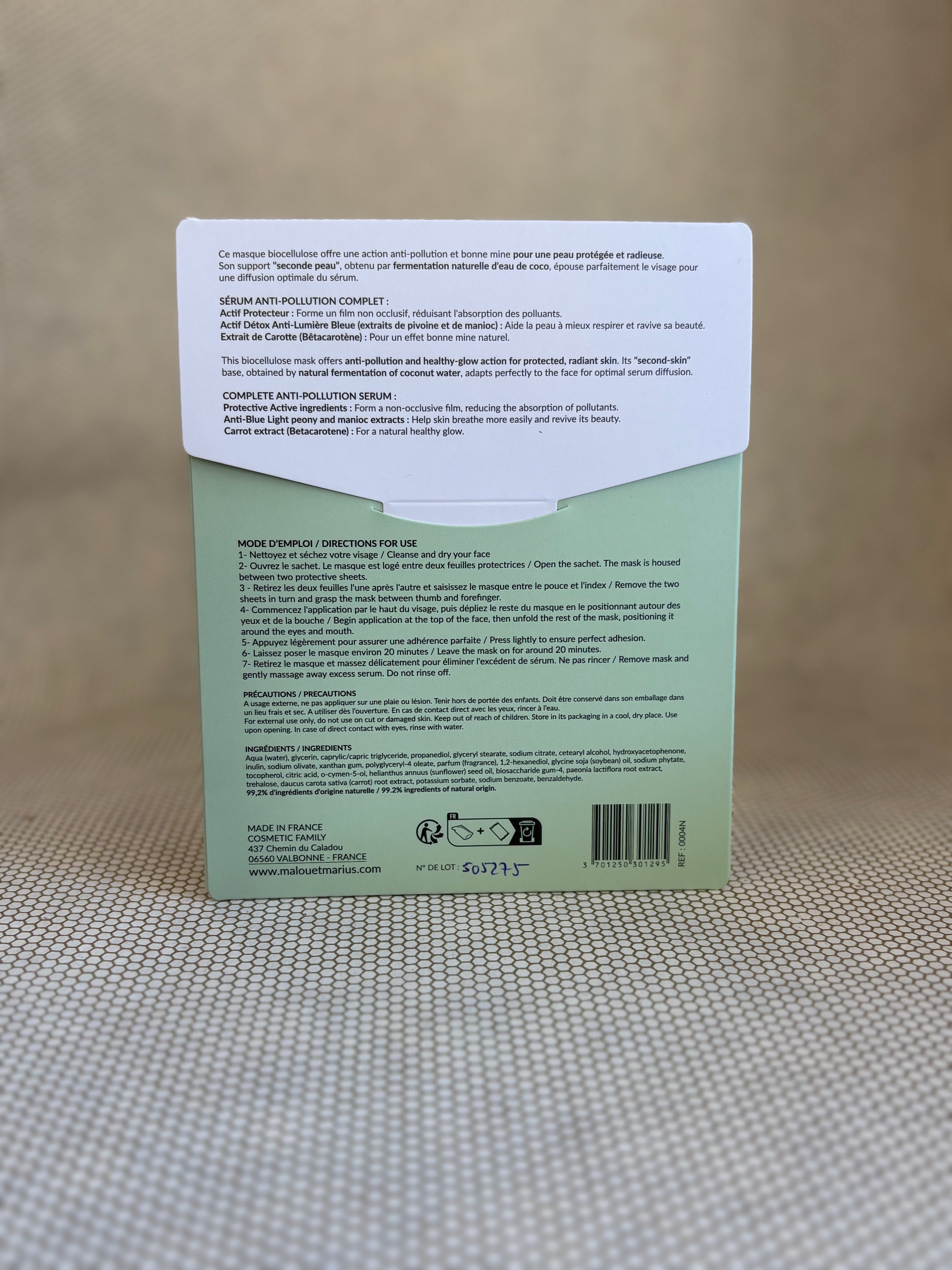 back of Malou & Marius anti-pollution detox mask white and green packaging on a neutral background