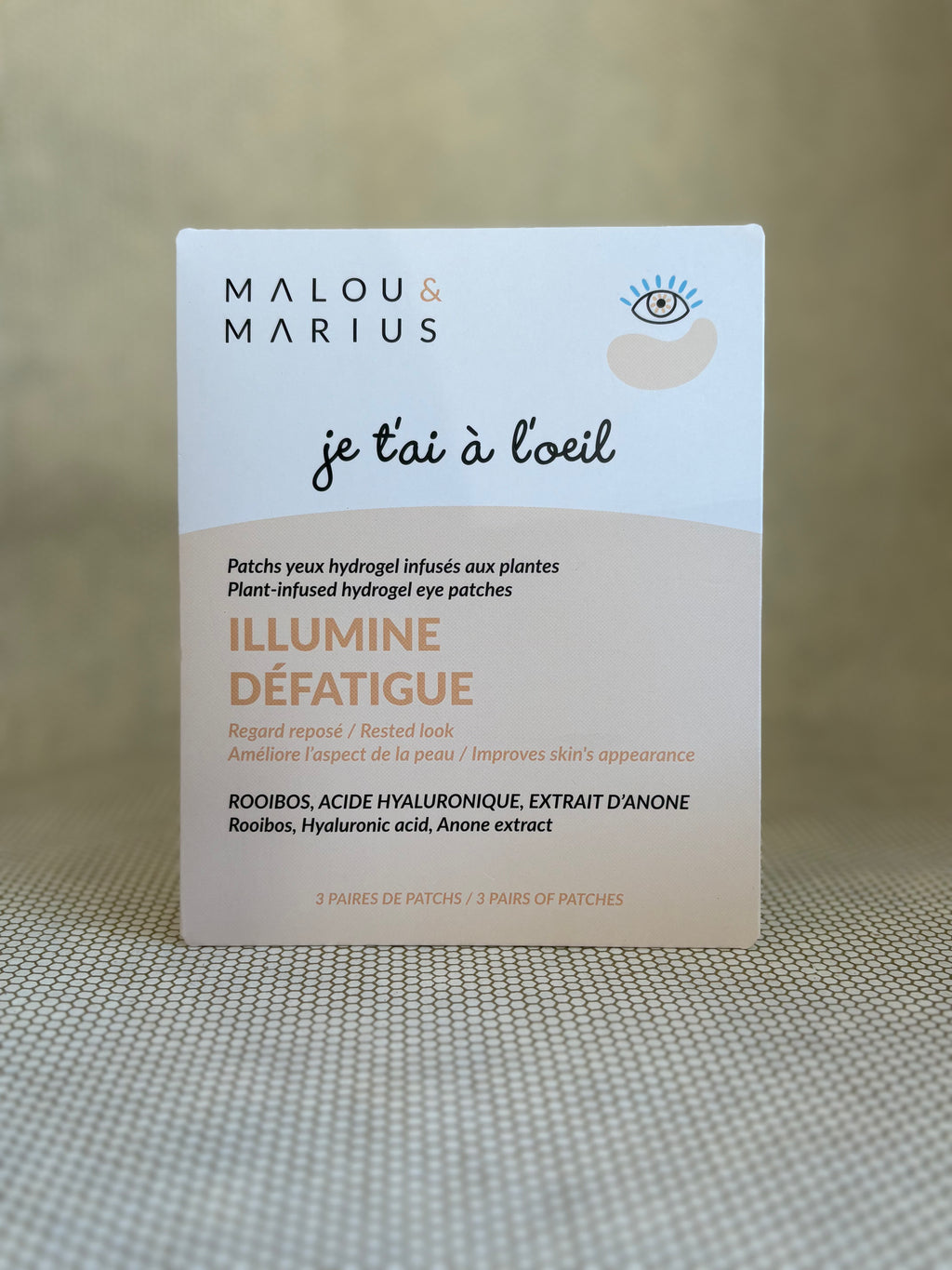 peach and white packaging of Malou & Marius eye patches on a textured surface