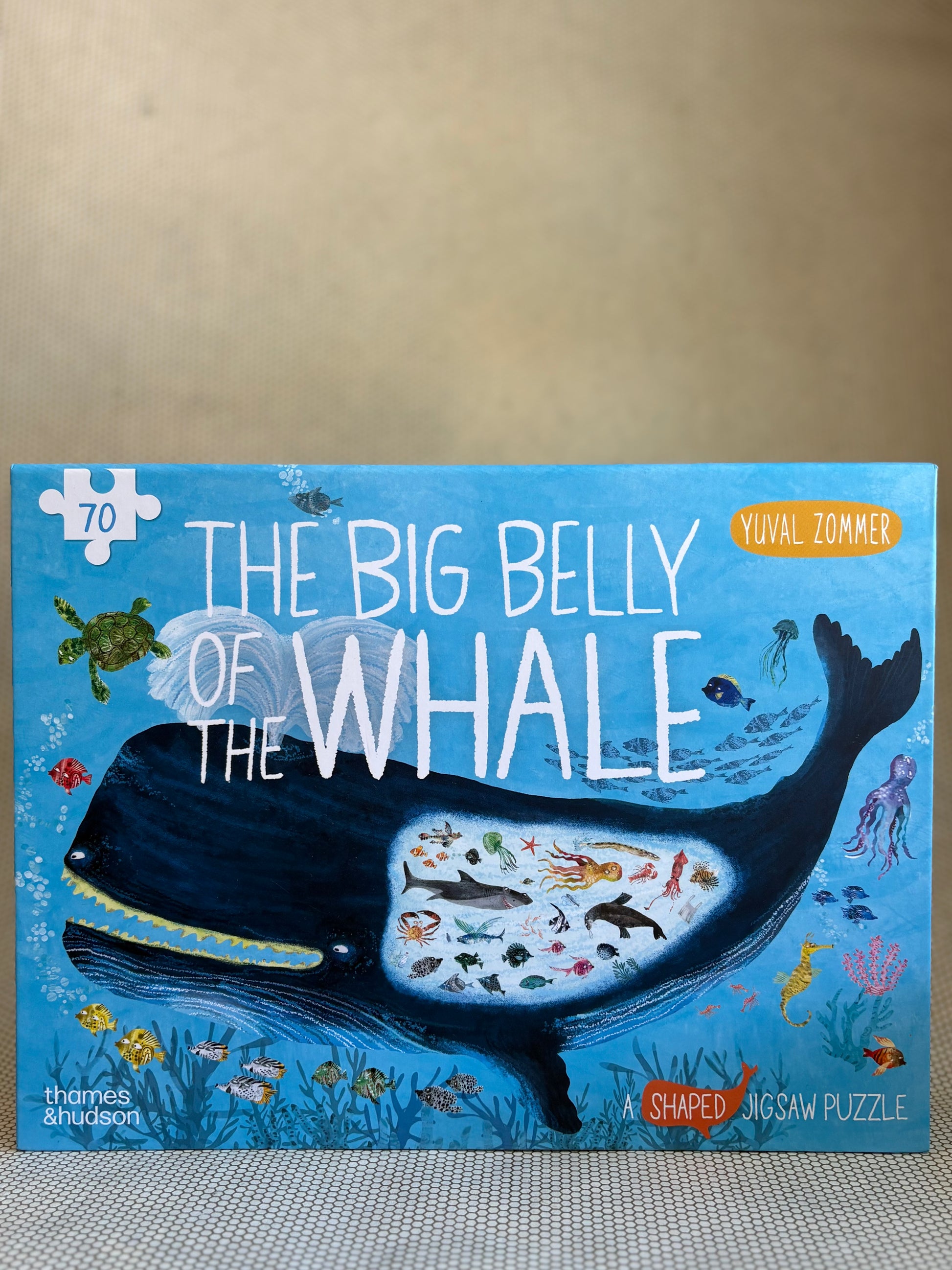 Jigsaw puzzle box titled 'The Big Belly of the Whale' by Yuyal Zommer on a neutral background