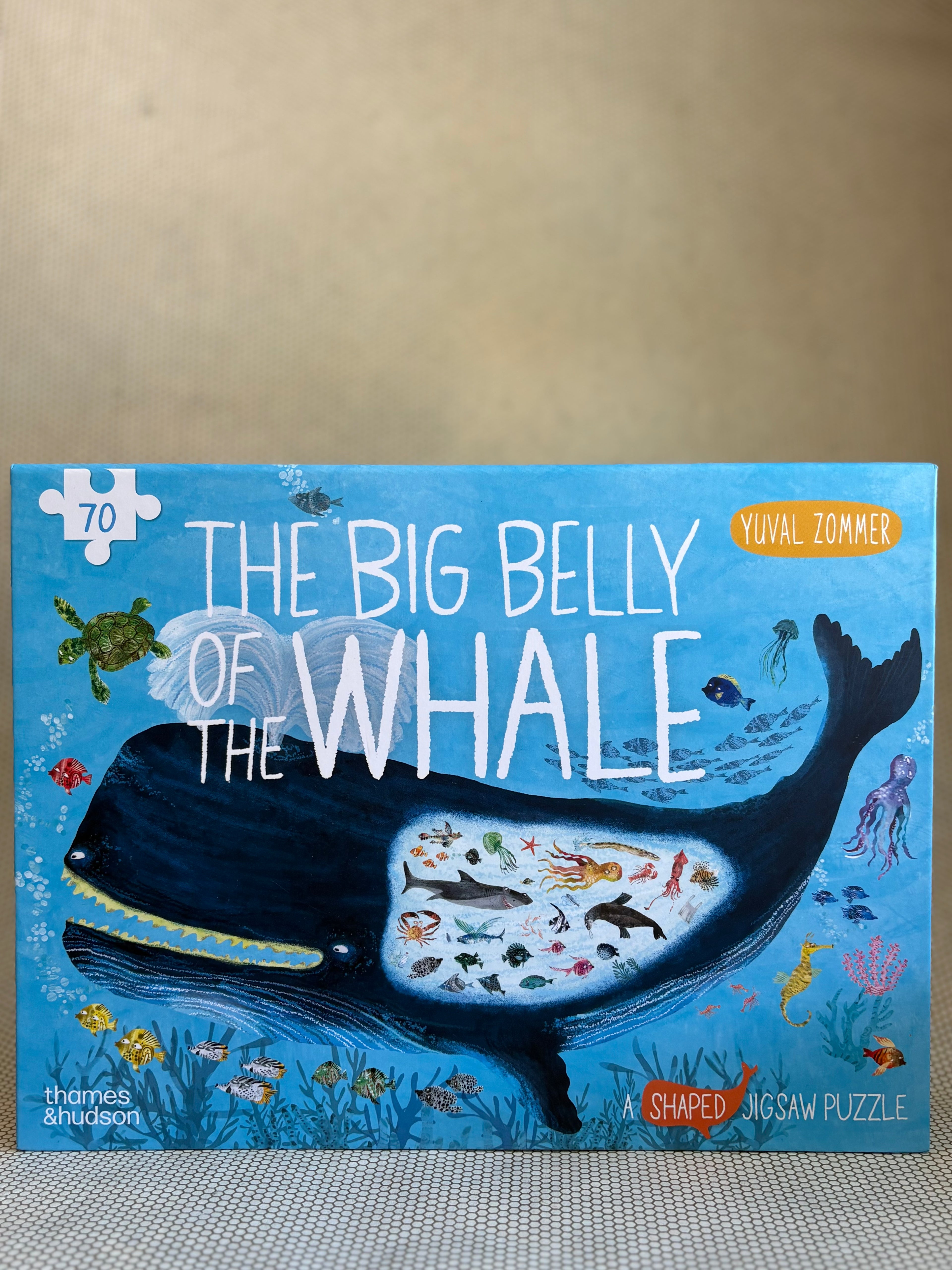 Jigsaw puzzle box titled 'The Big Belly of the Whale' by Yuyal Zommer on a neutral background