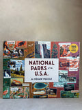 Jigsaw puzzle box featuring national parks of the USA on a neutral background