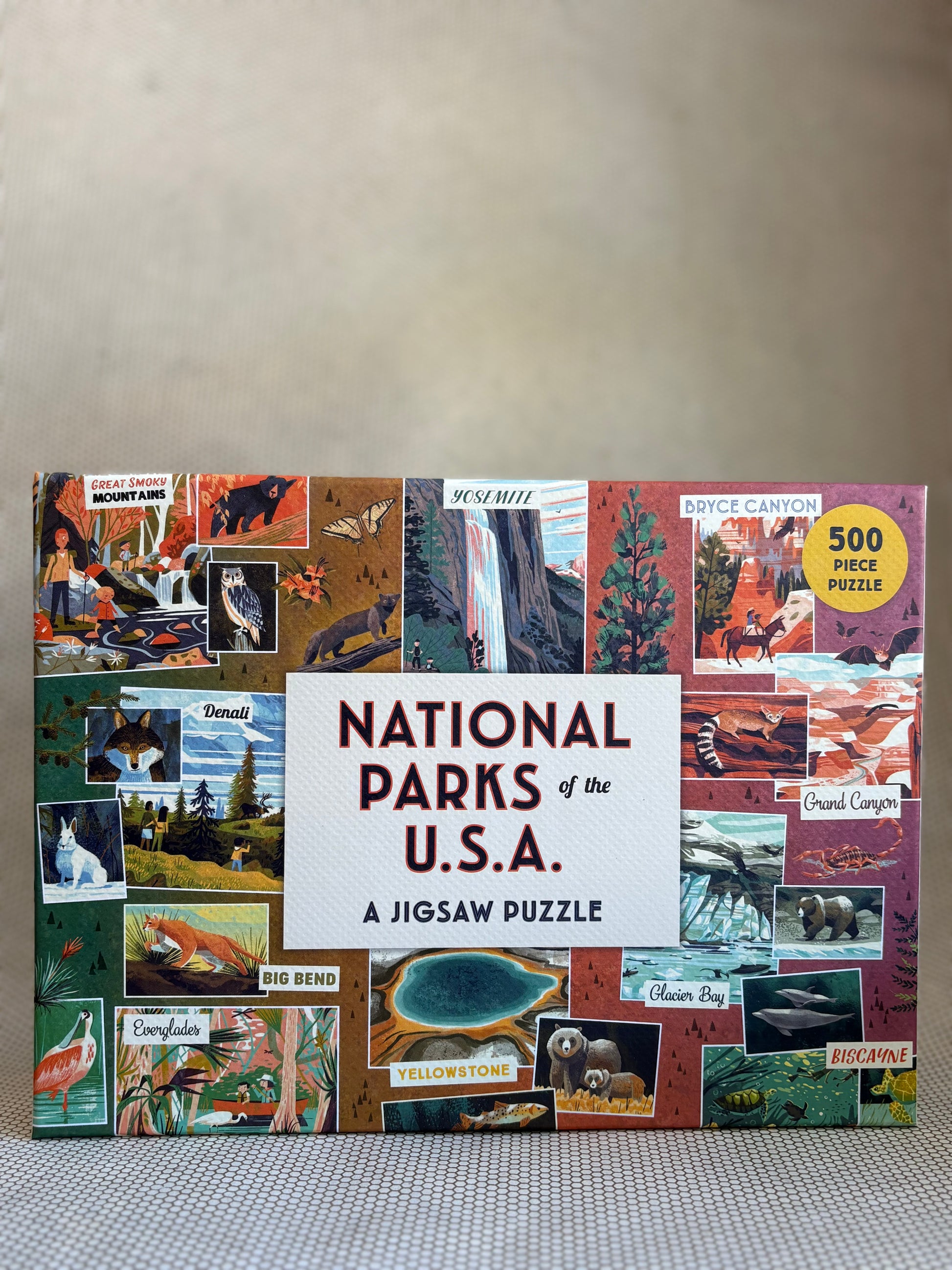 Jigsaw puzzle box featuring national parks of the USA on a neutral background
