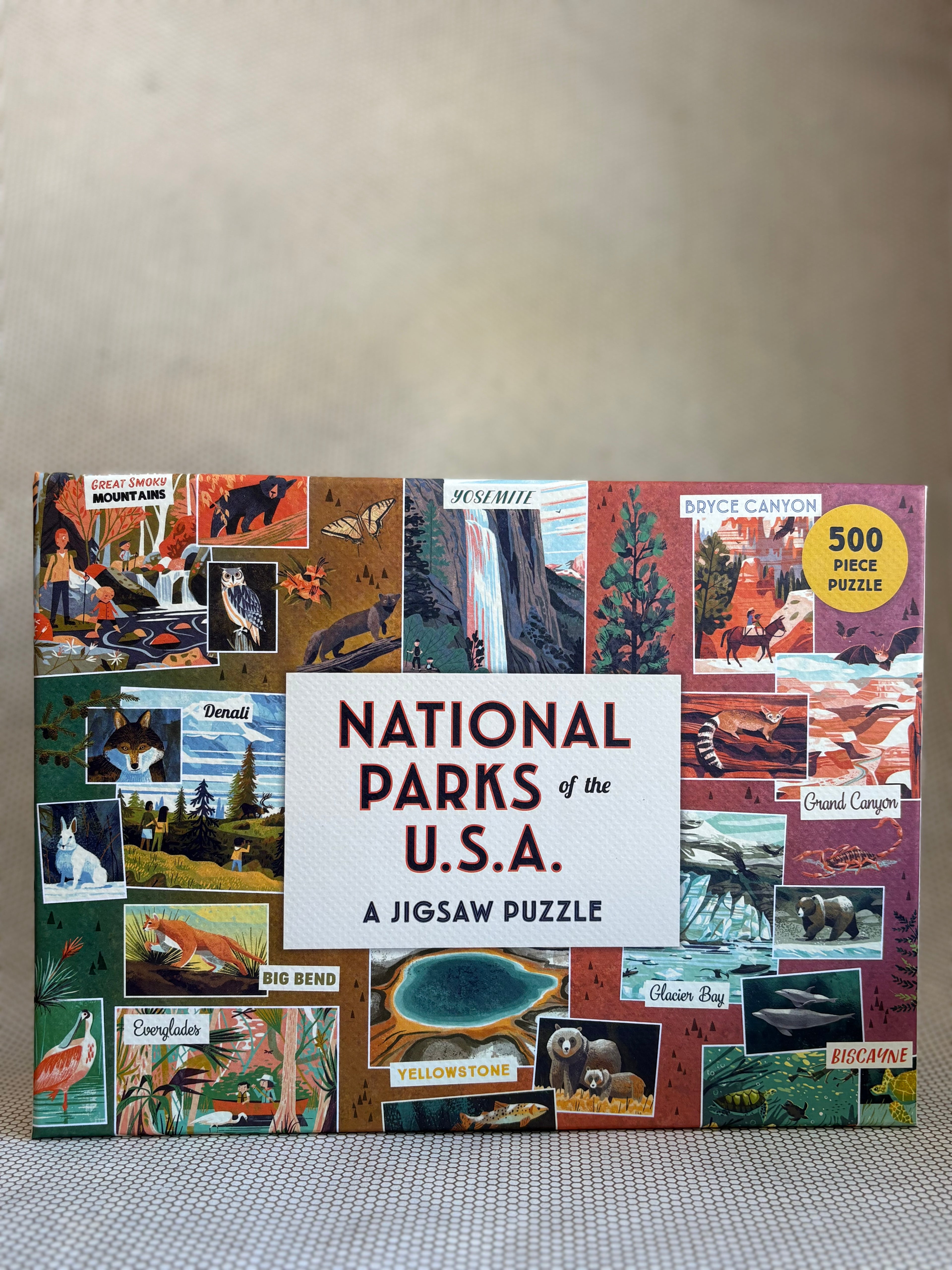Jigsaw puzzle box featuring national parks of the USA on a neutral background