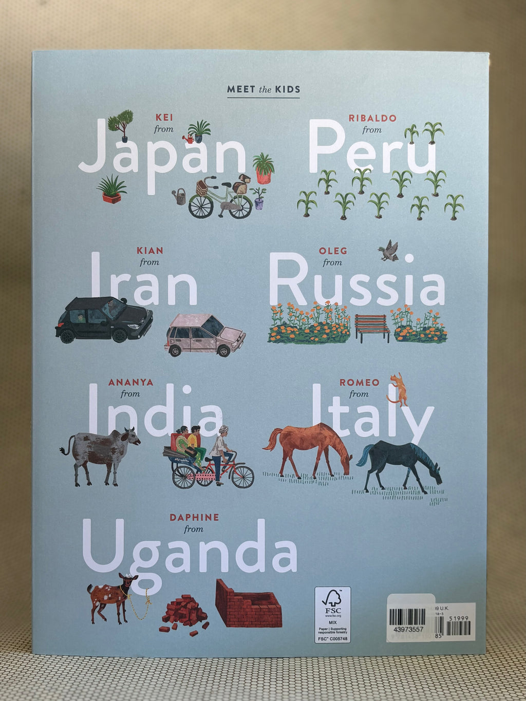 Back of book cover with illustrations and text about children from various countries on a light blue background.