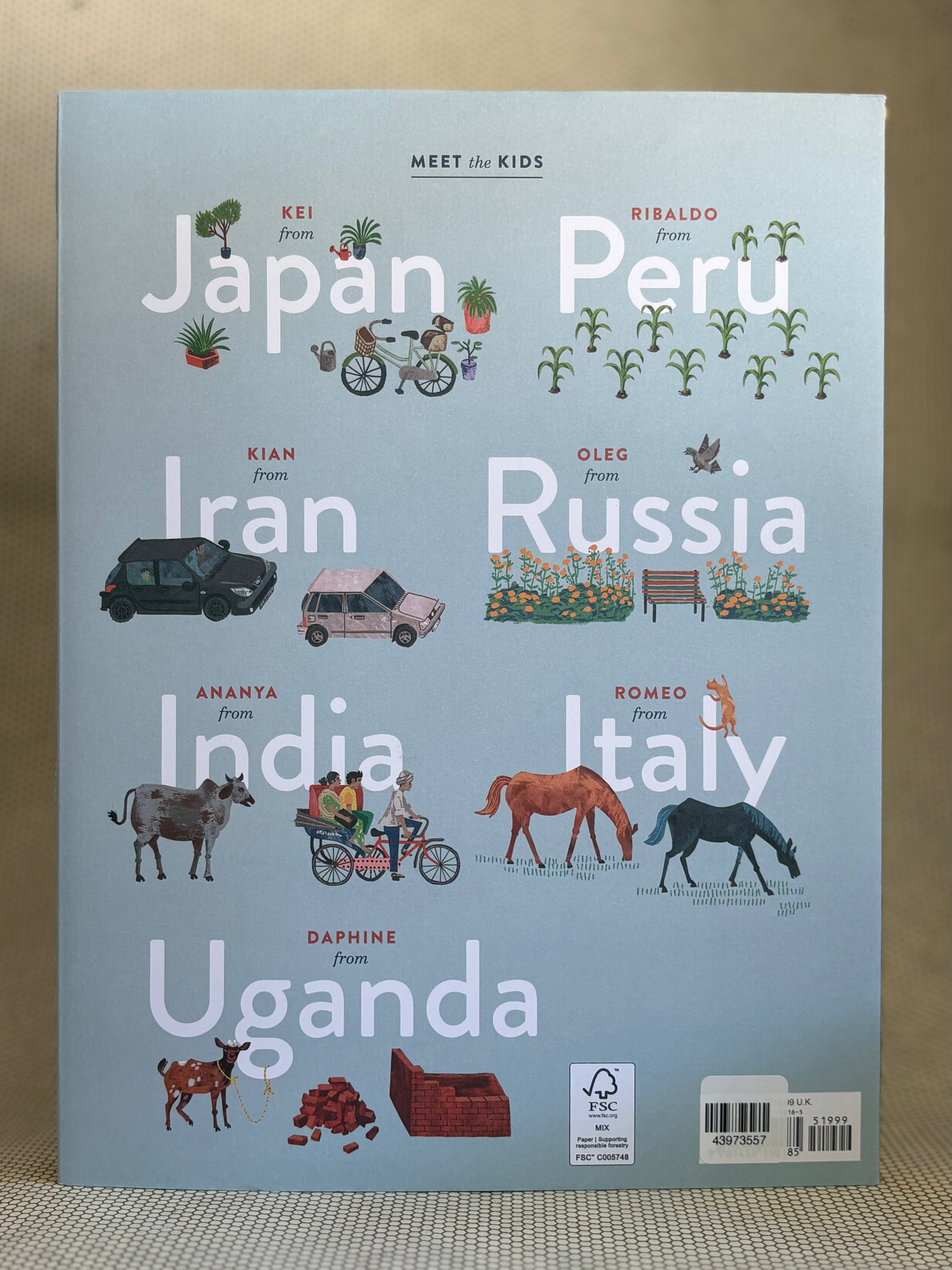 Back of book cover with illustrations and text about children from various countries on a light blue background.