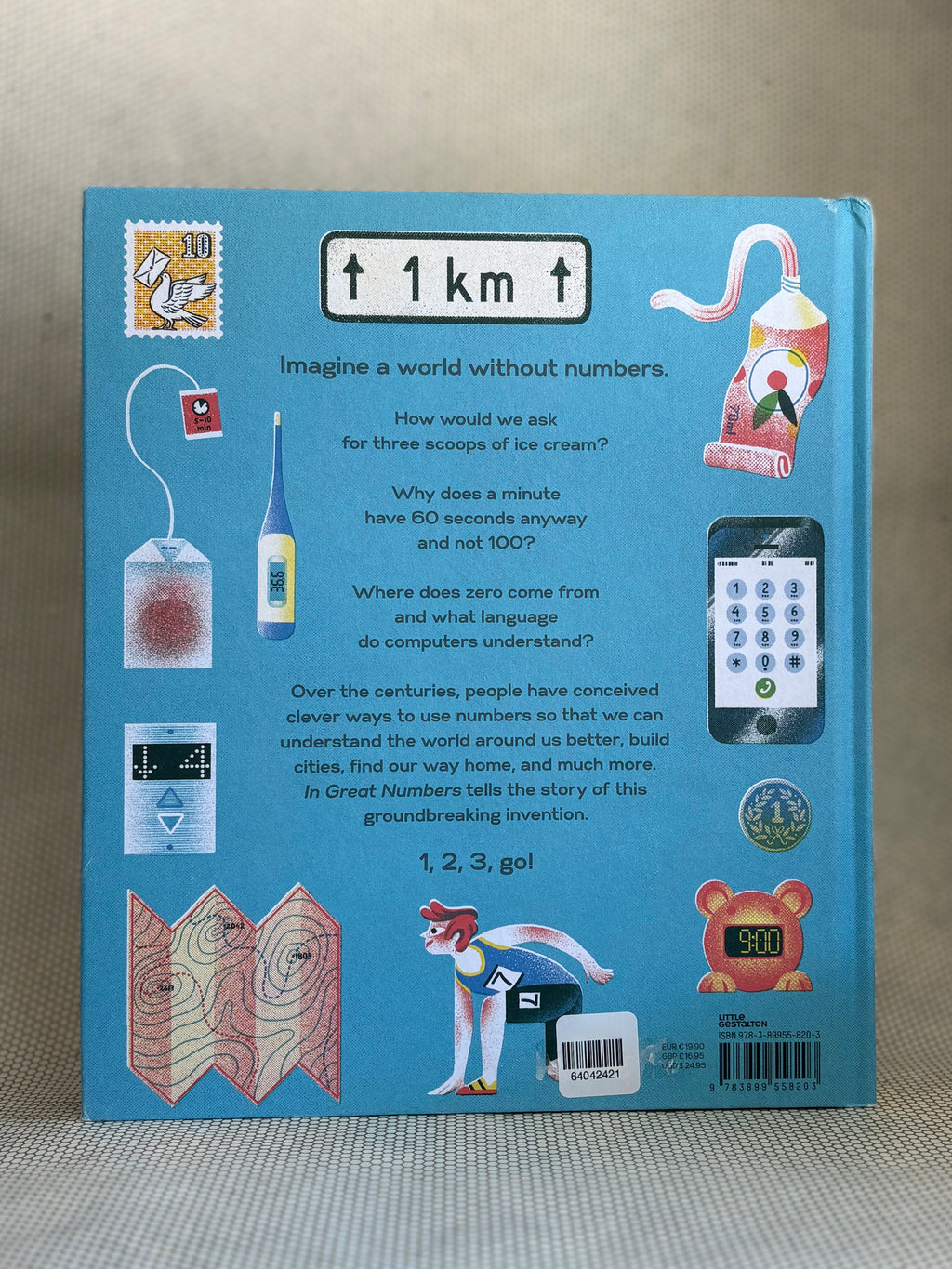 Back of book cover with illustrations and text on a textured surface