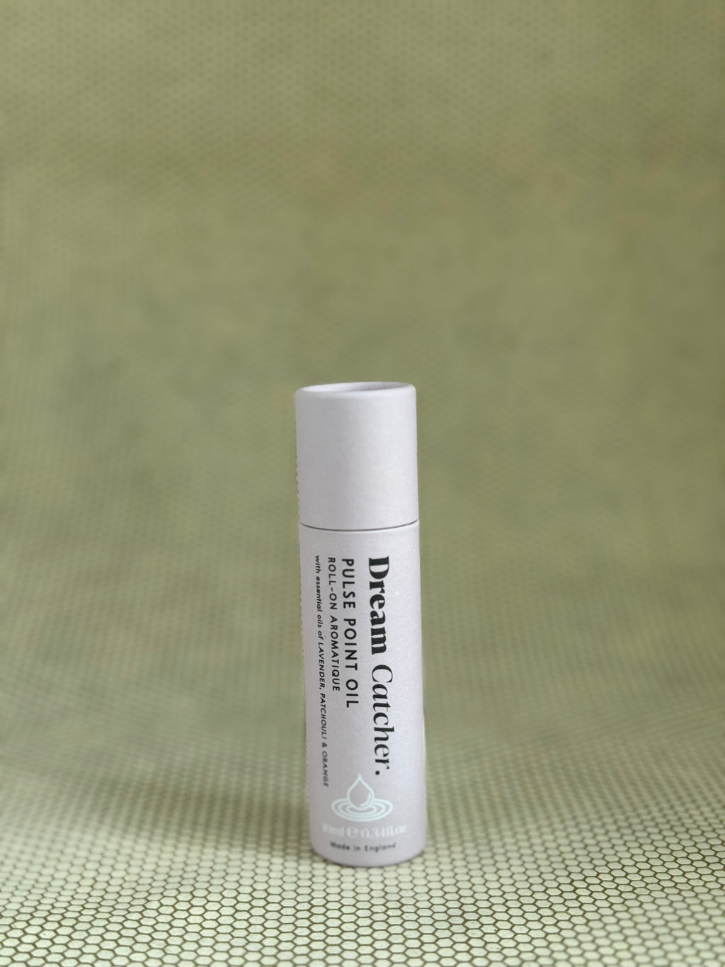 Osmology Dream Catcher pulse point roll-on aromatherapy oil in baby pink packaging. 