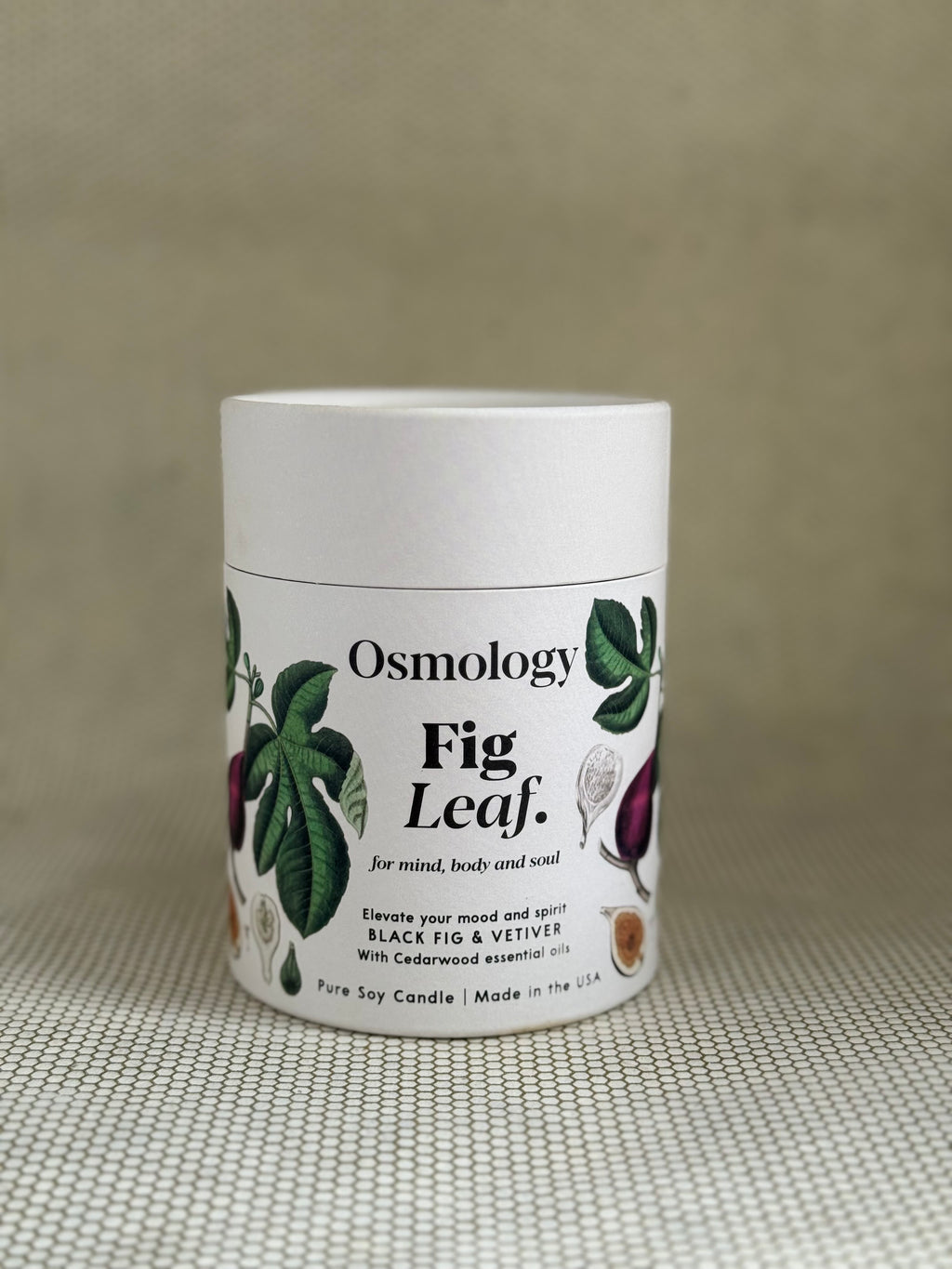 Osmology Fig Leaf candle. 
100% Plant-Based Wax Vegan Cruelty-free. Fully Recyclable packaging 7oz (200g)