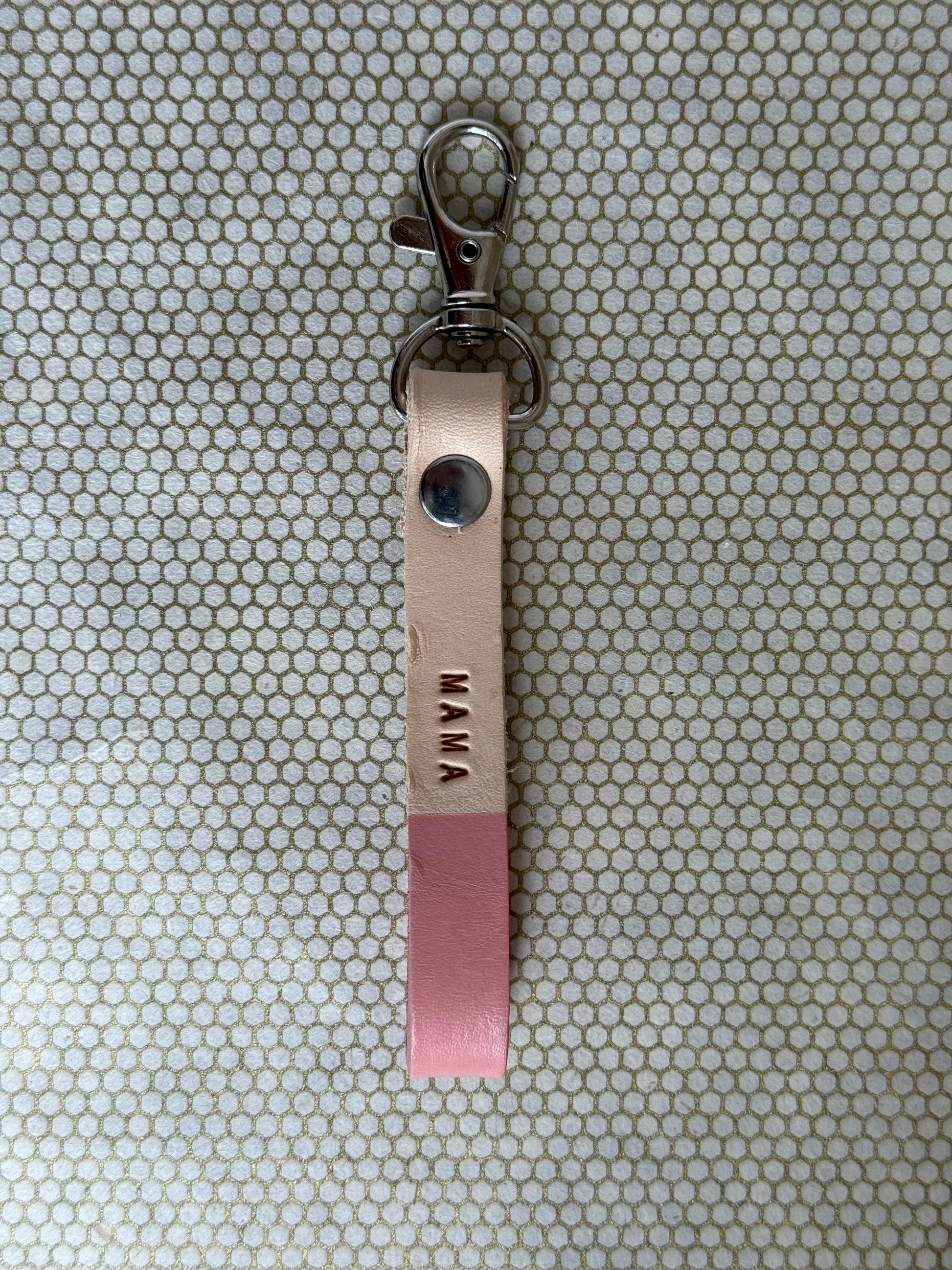 pink color keychains with leather straps and "mama" lettering on leather. 
