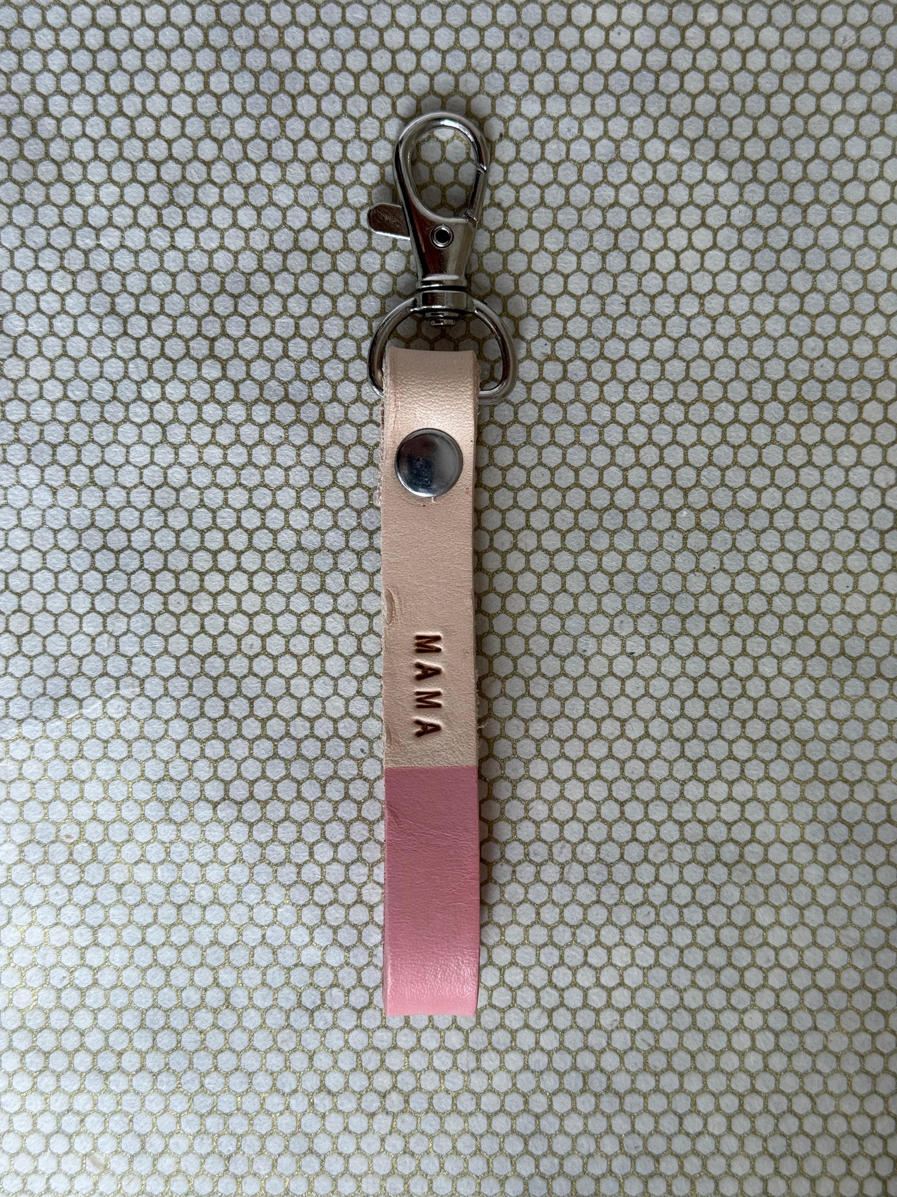 pink color keychains with leather straps and "mama" lettering on leather. 