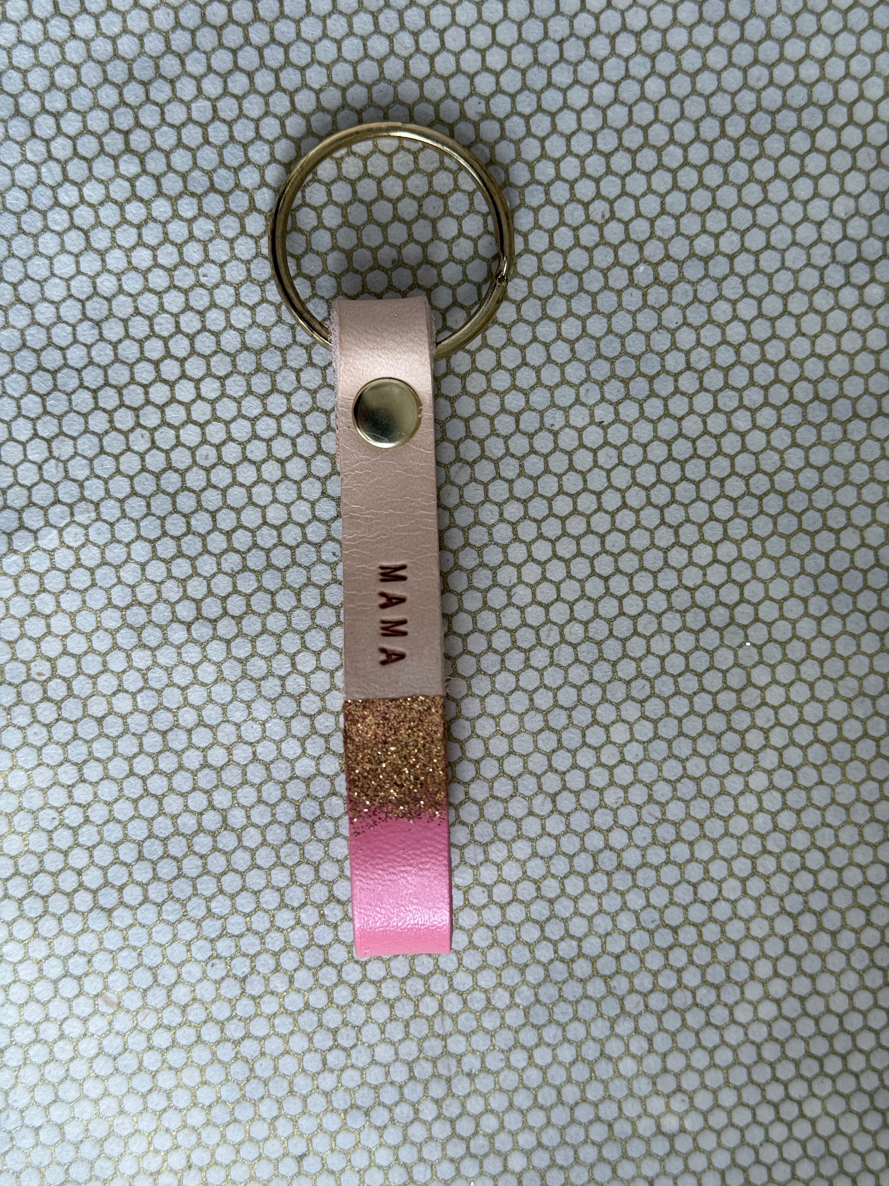 pink color keychains with leather straps and "mama" lettering on leather. 