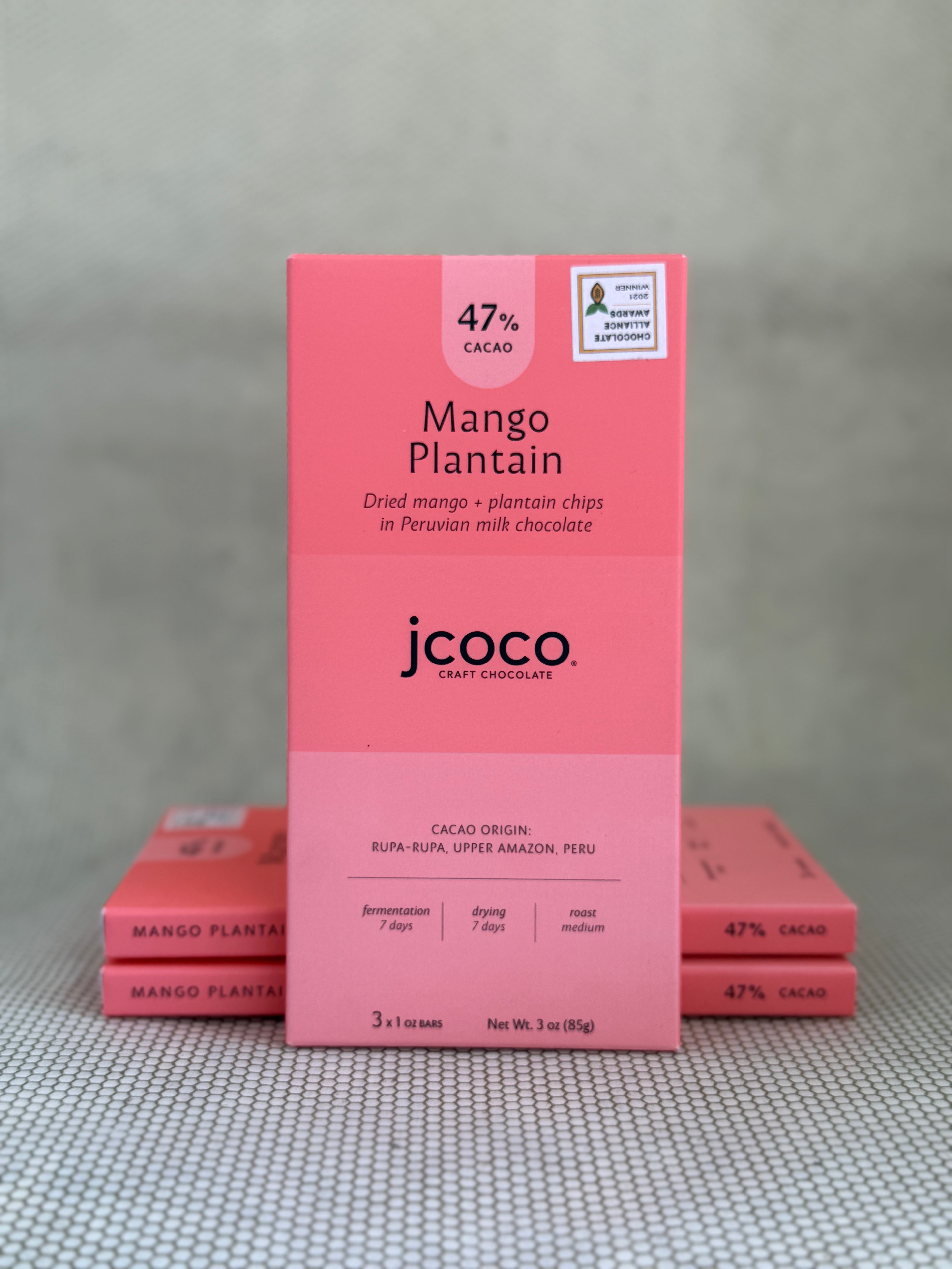 light peach pink dark chocolate bar packaging with jcoco branding on neutral background. 