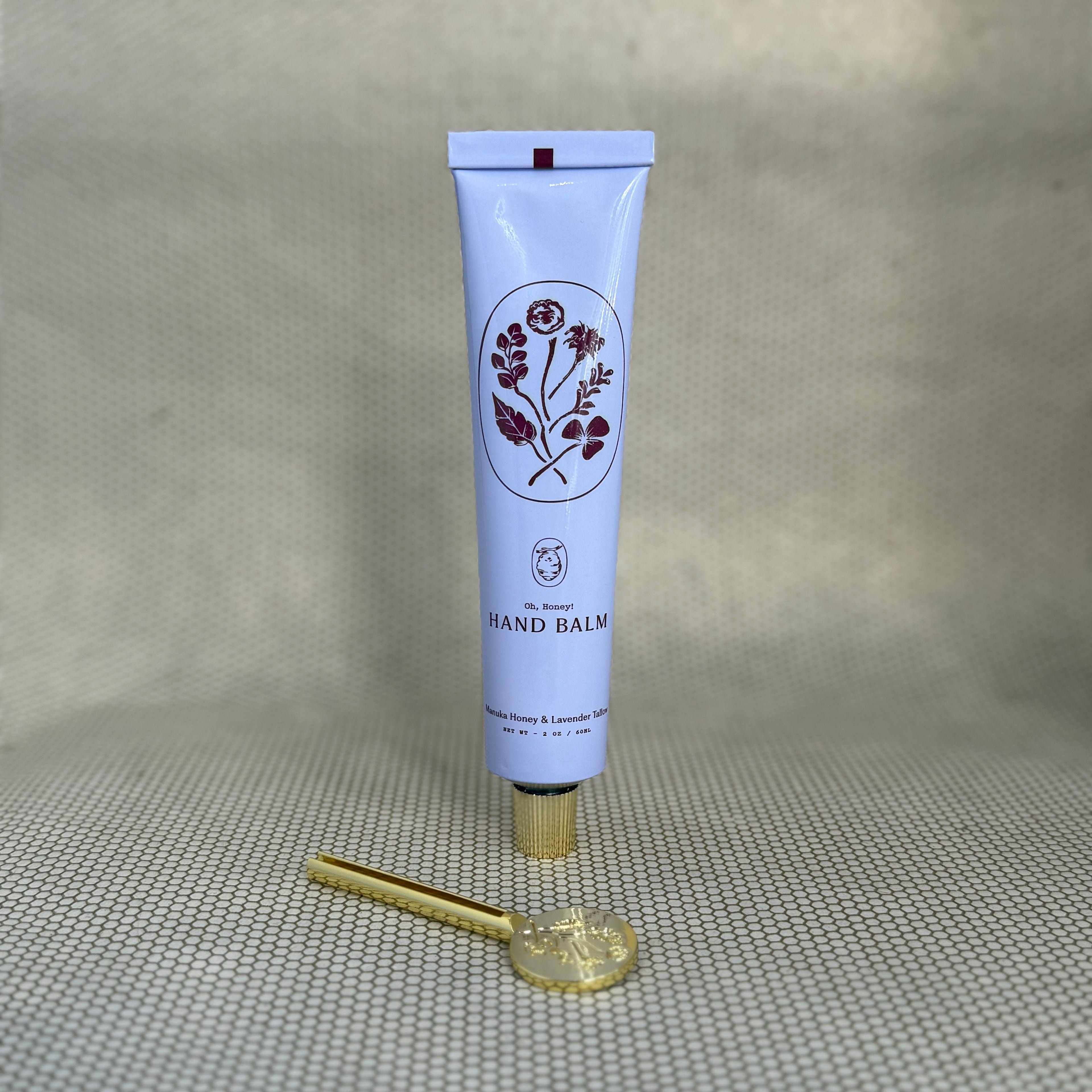 light purple tube of My Neighbor's manuka honey and lavender hand balm with floral graphic. 