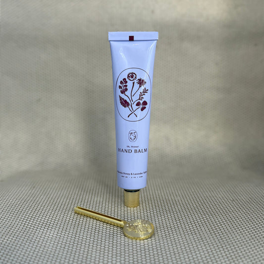 light purple tube of My Neighbor's manuka honey and lavender hand balm with floral graphic. 