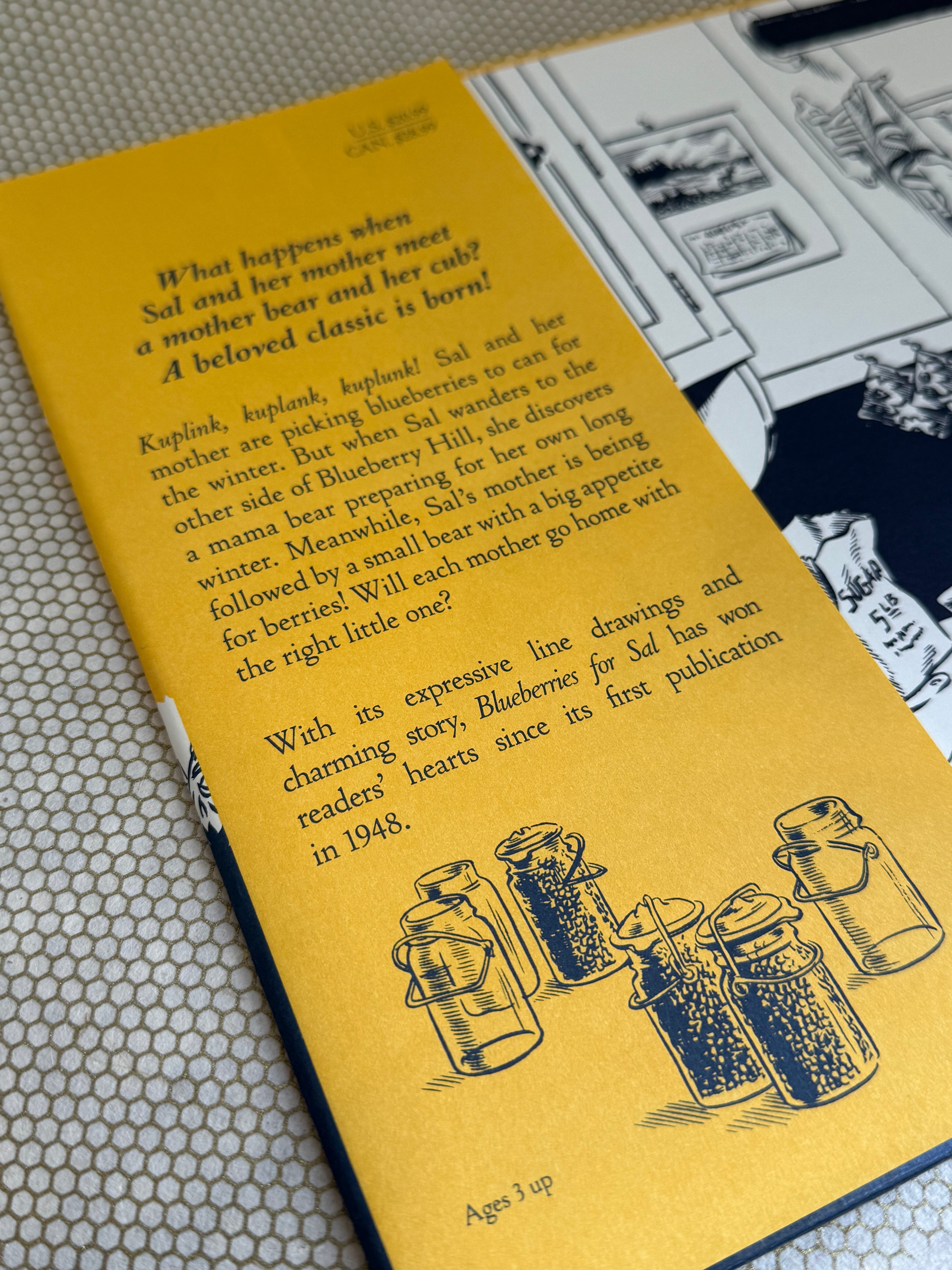 Book with yellow cover featuring black illustrations and text