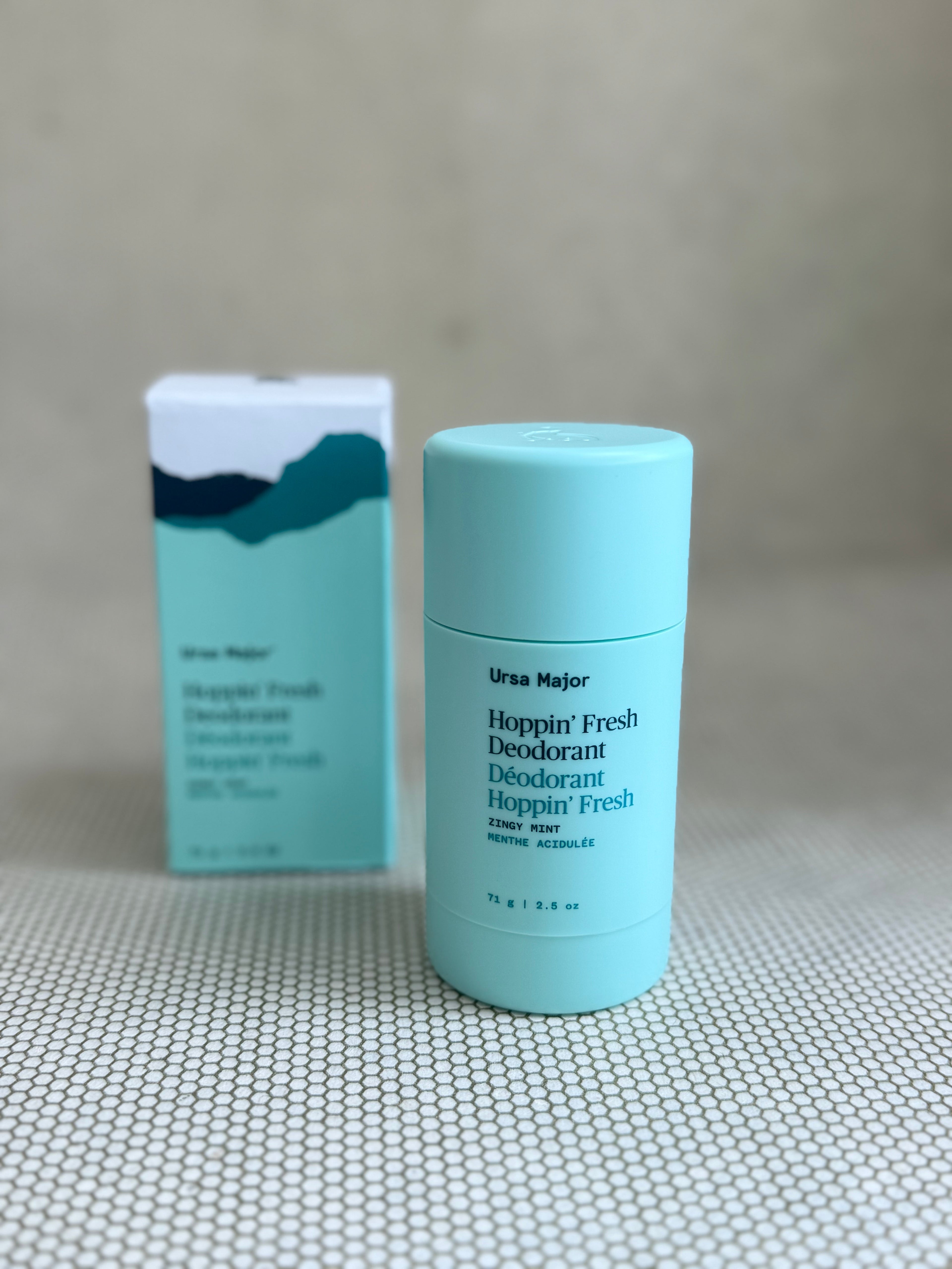 Ursa Major deodorant stick and packaging on a neutral background