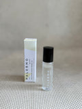 Roll-on bottle of Palermo body enlivening aromatherapy oil with small white and yellow box. 