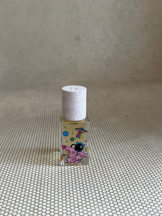 Maison Matine perfume with pink astronaut picture on glass bottle. 