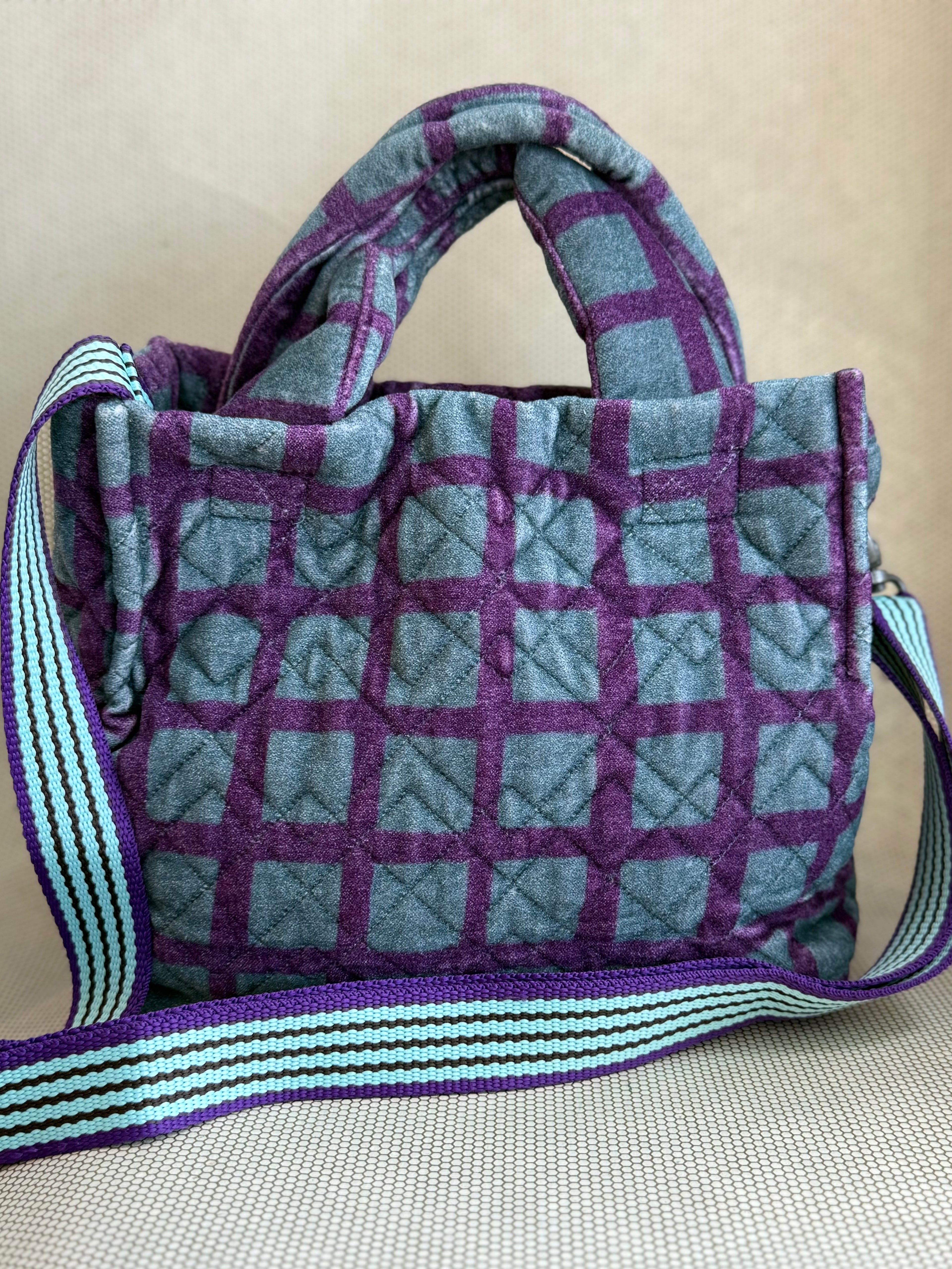 Epice blue and purple handbag with handler and strap. 