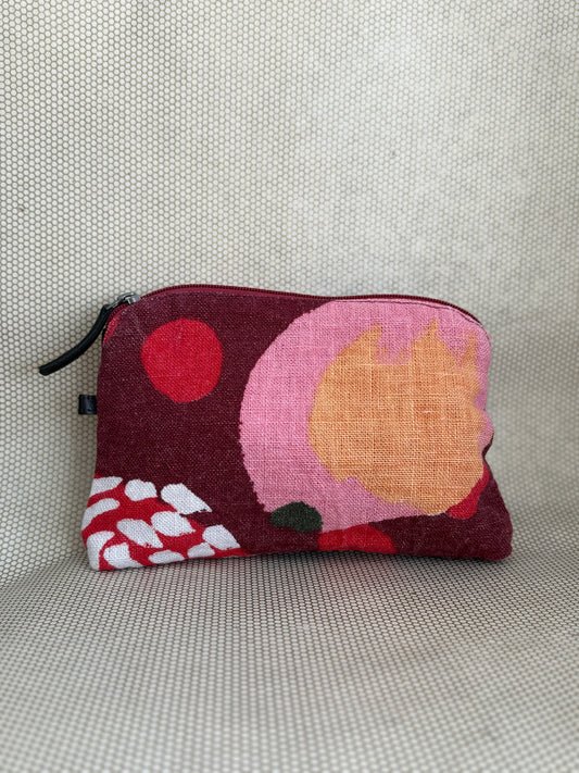 Small pouch with abstract design on a textured surface