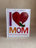 Book titled 'I ❤️ Mom with The Very Hungry Caterpillar' on a textured surface.