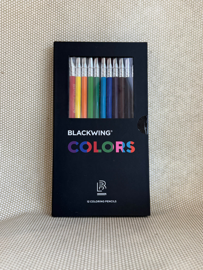 Blackwing Colors coloring pencils set in a black packaging on a textured beige background