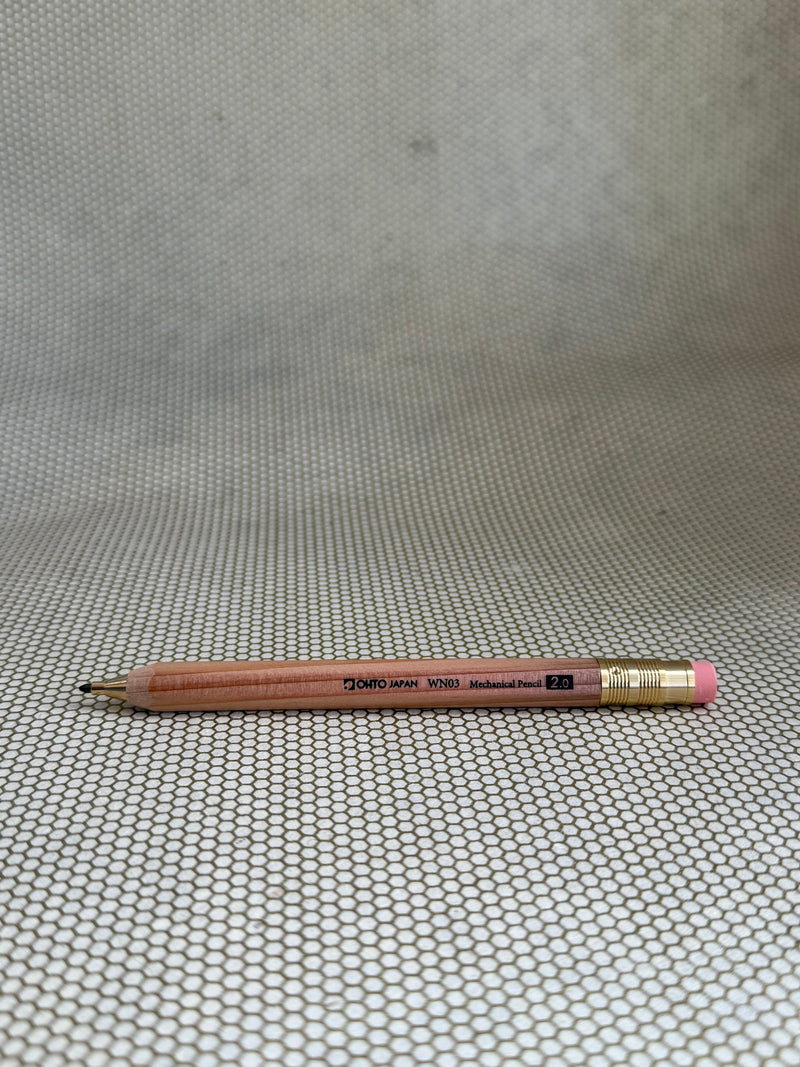 large wooden mechanical pencil with eraser on neutral background. 