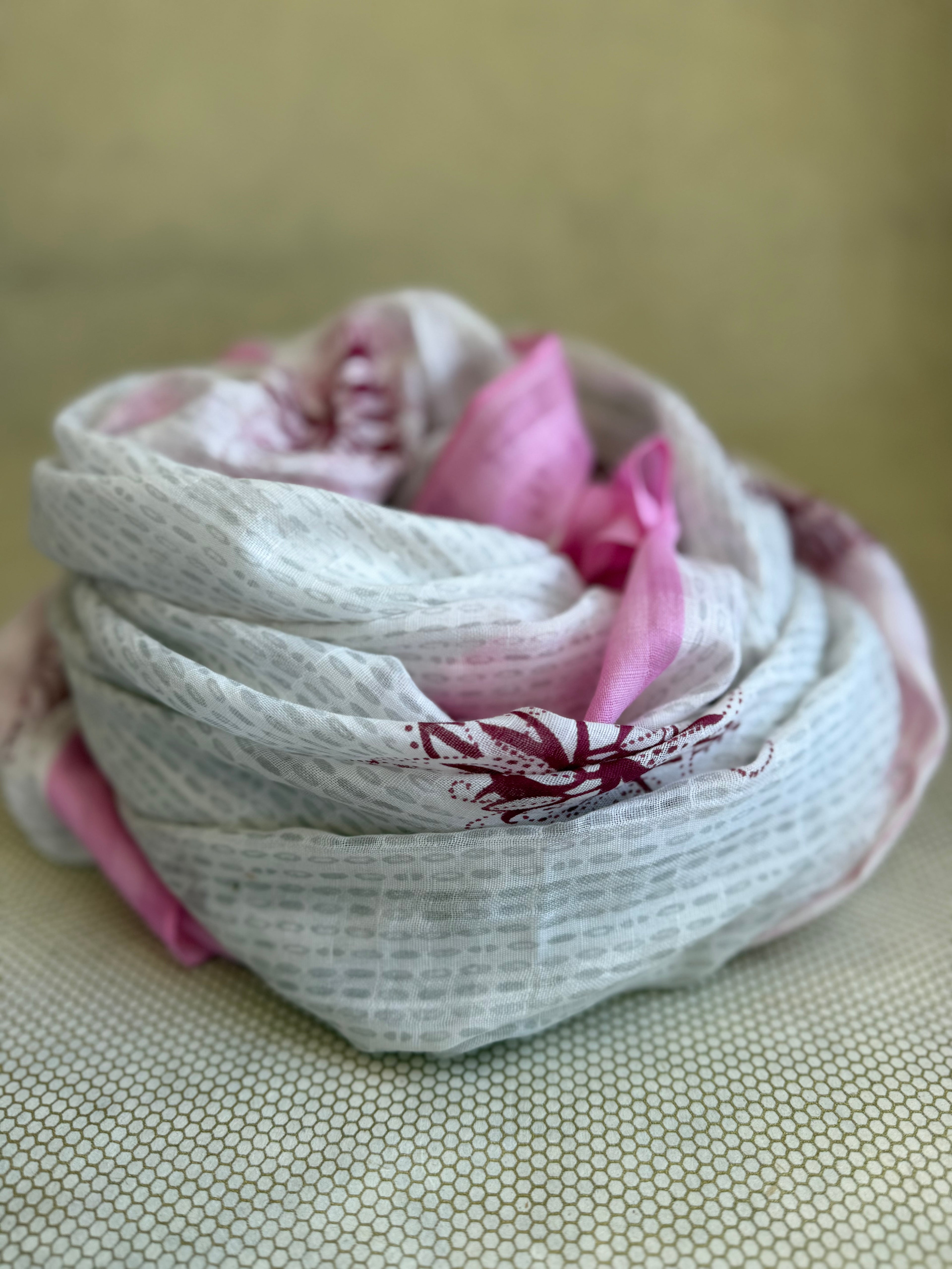 bunched lightweight scarf with pink, white and red design. 