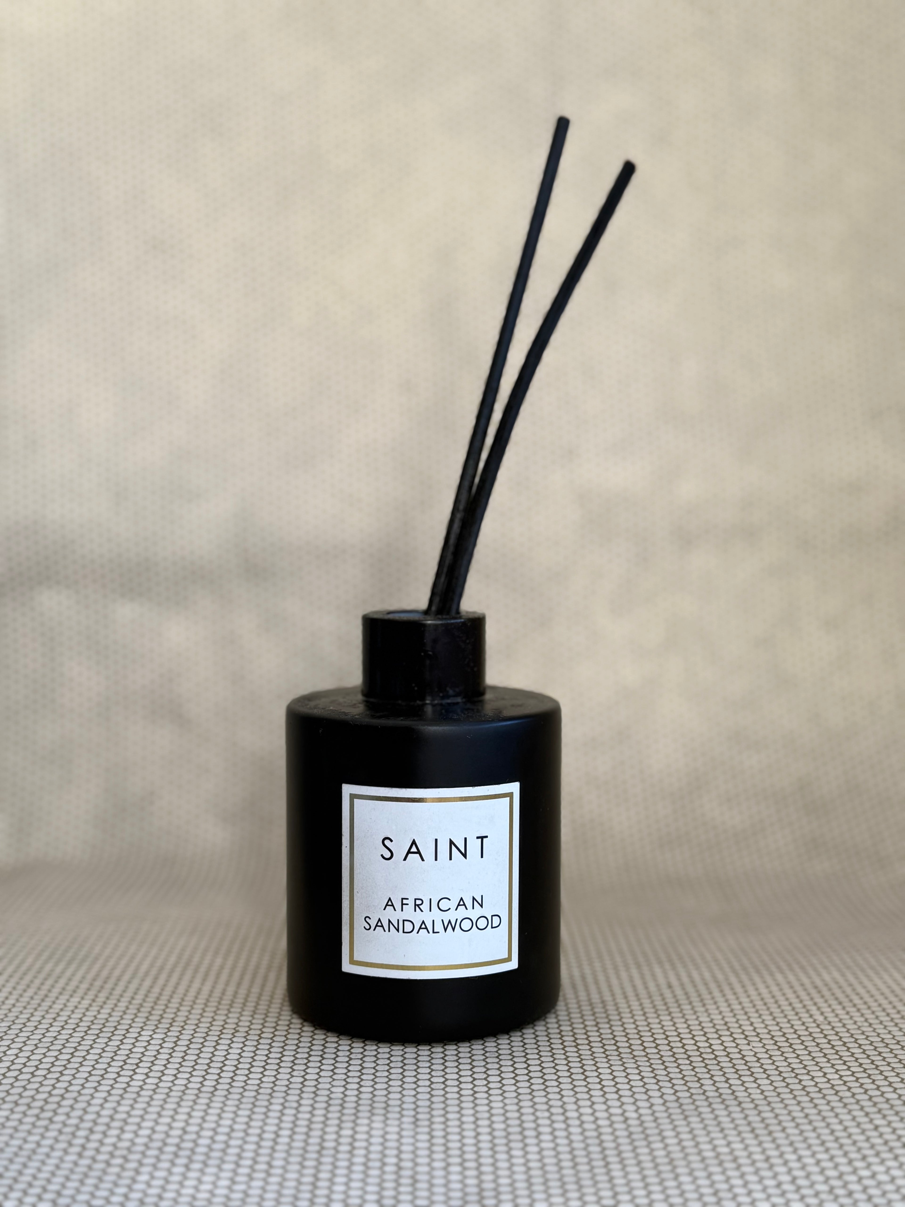 black reed diffuser bottle. black diffuser wooden reed sticks. SAINT. african sandalwood. 5oz (145mL)