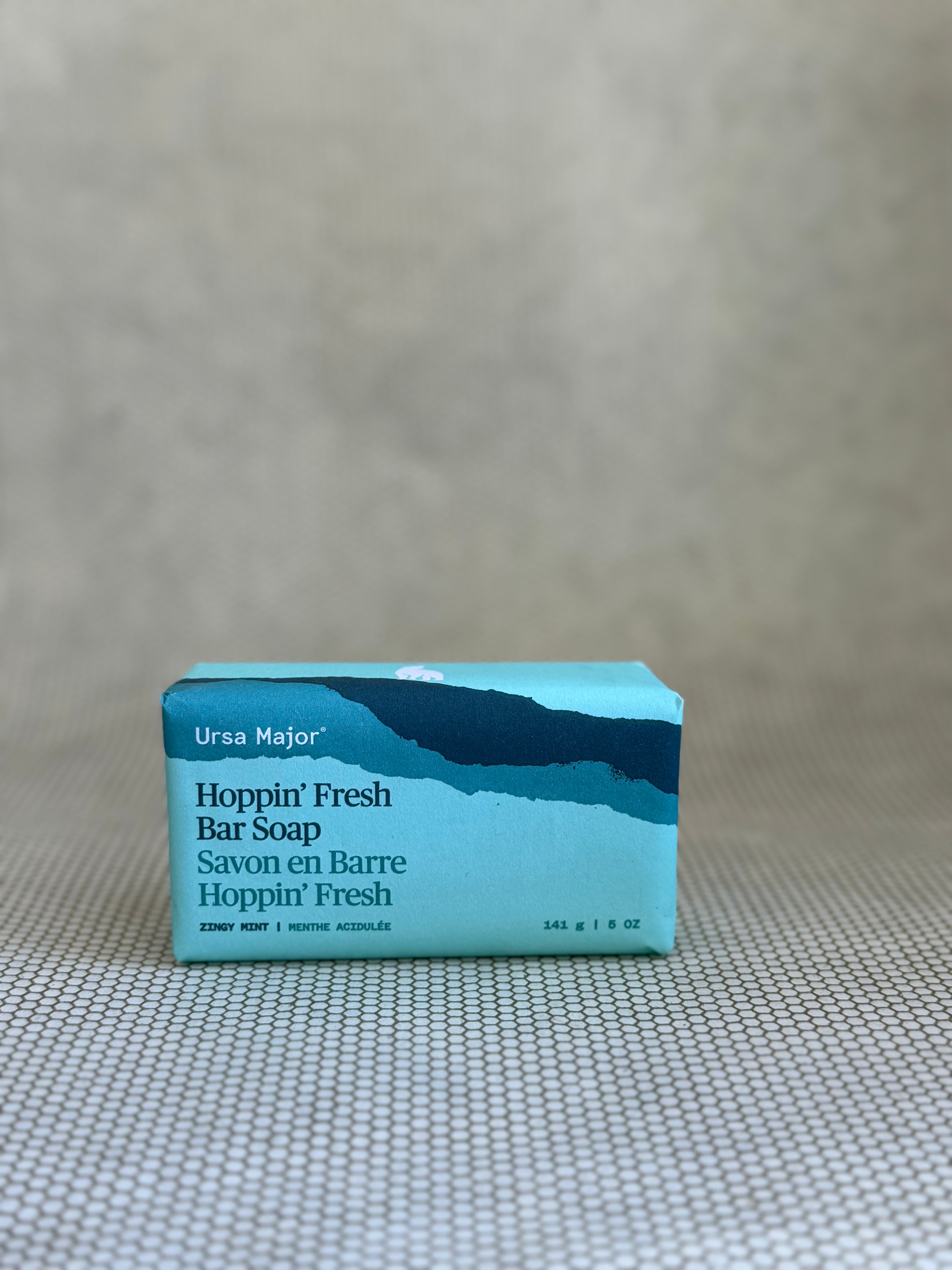 Ursa Major Hoppin' Fresh Bar Soap packaging on a textured surface