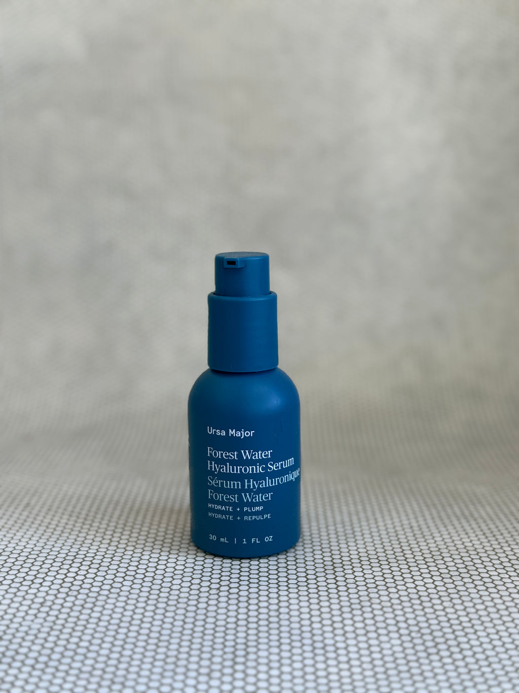 blue pump bottle of Ursa Major Forest Water Hyaluronic Serum.