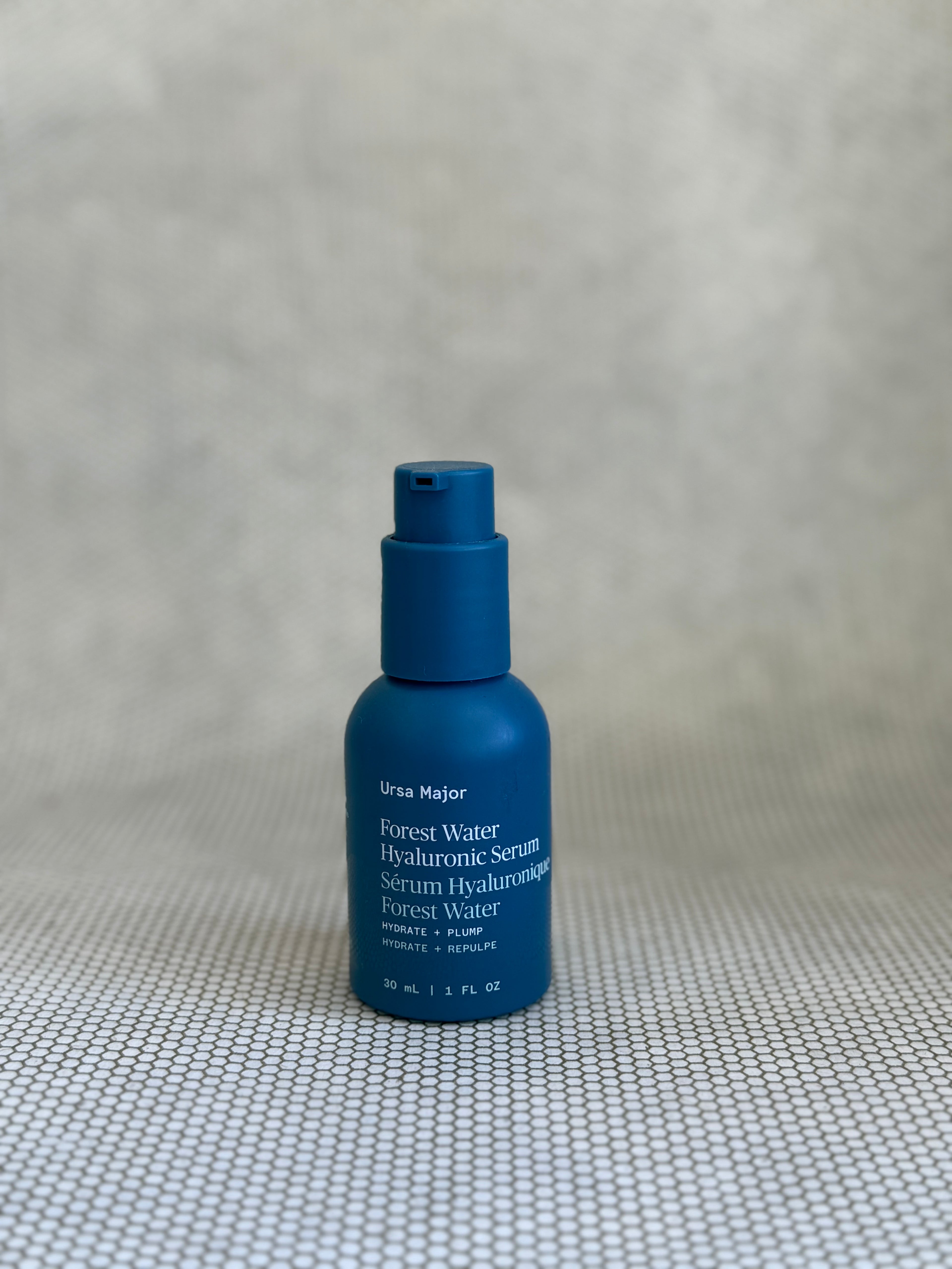 blue pump bottle of Ursa Major Forest Water Hyaluronic Serum.