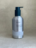 silver metallic pump bottle of Ursa Major Botanic Buzz Hand Wash