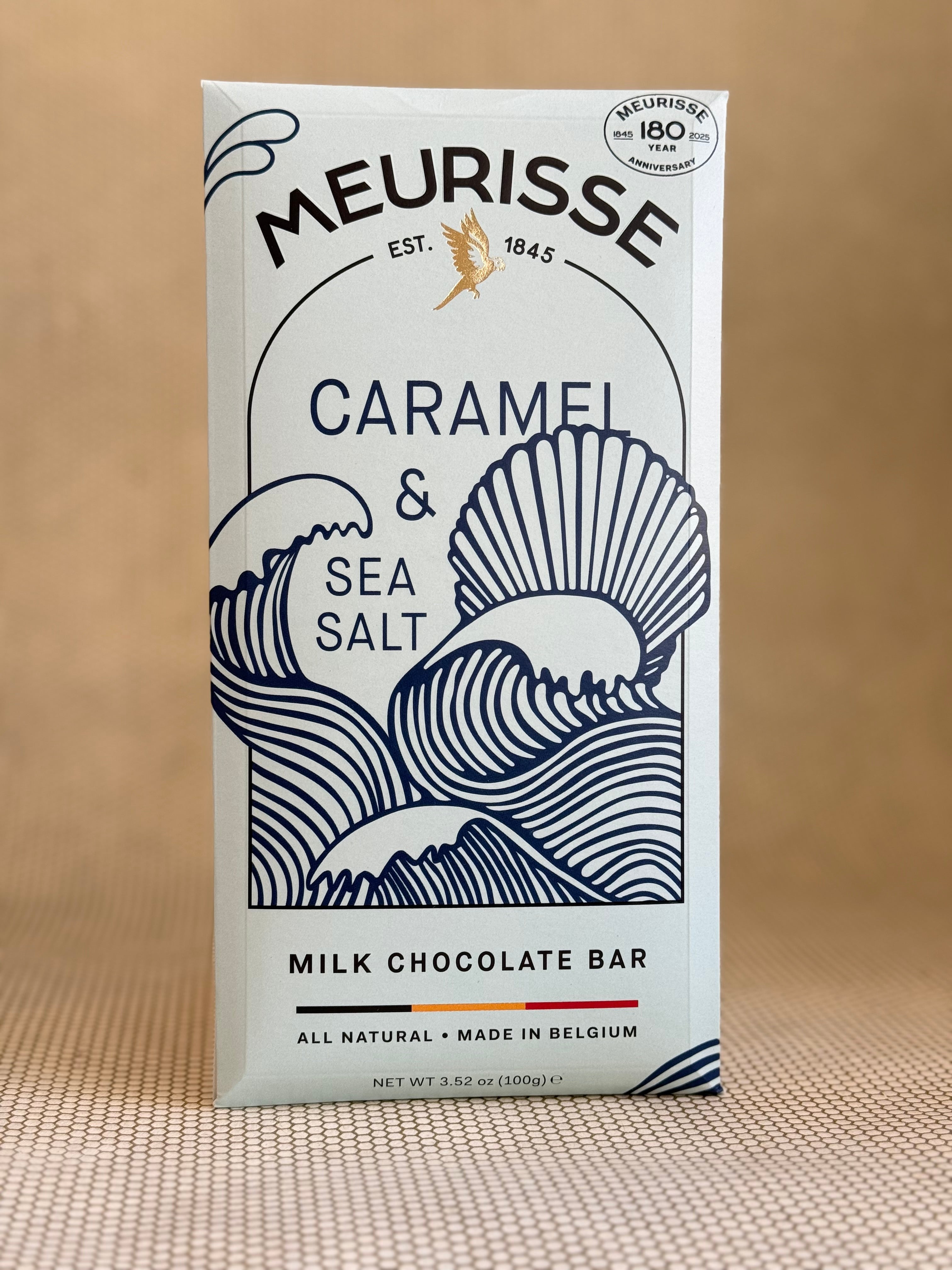 Meurisse caramel and sea salt milk chocolate bar packaging on a beige background
