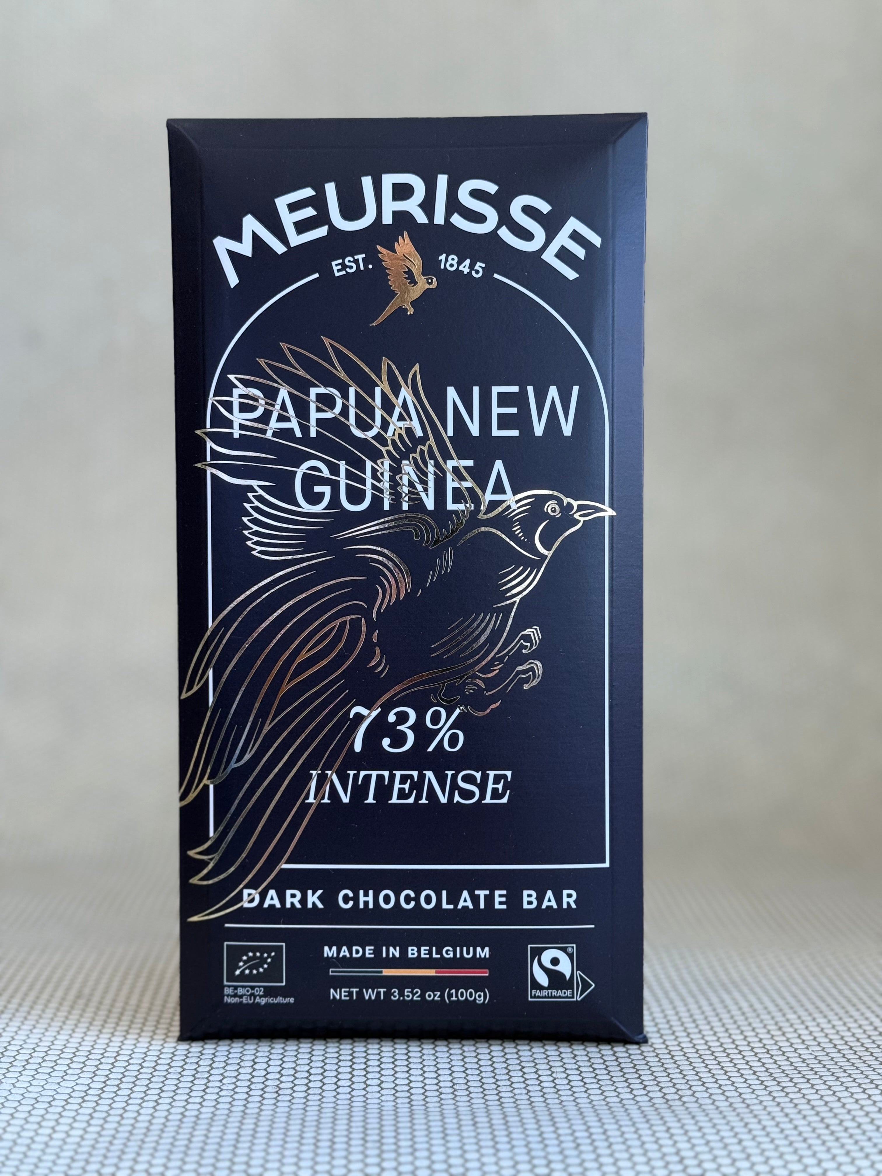 Meurisse Papua New Guinea 73% Intense dark chocolate bar packaging on a light gray background